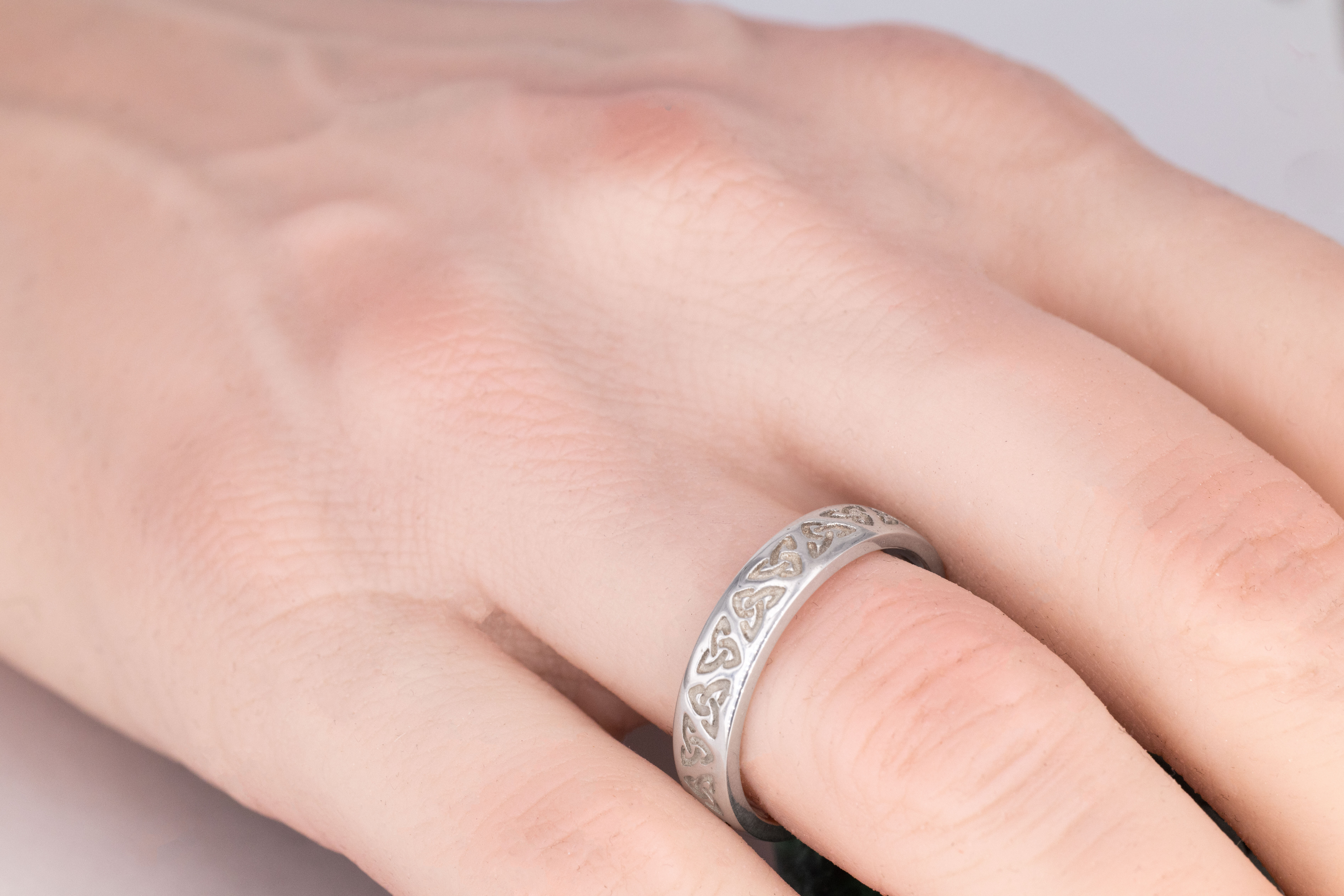 Striking Platinum Trinity Knot 5.5mm Ring For Men - Model Photo