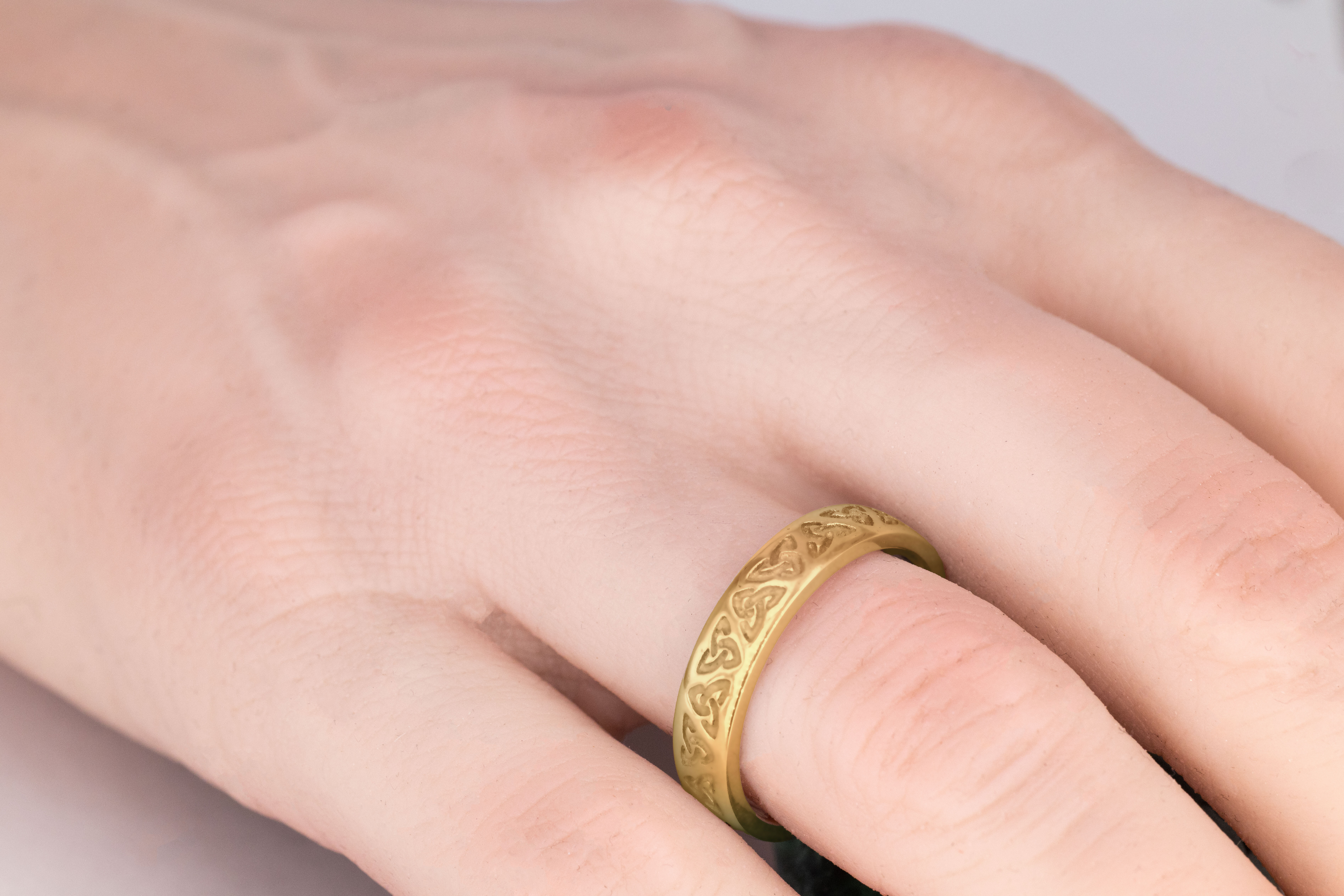 Striking Yellow Gold Trinity Knot 5.5mm Ring For Men - Model Photo