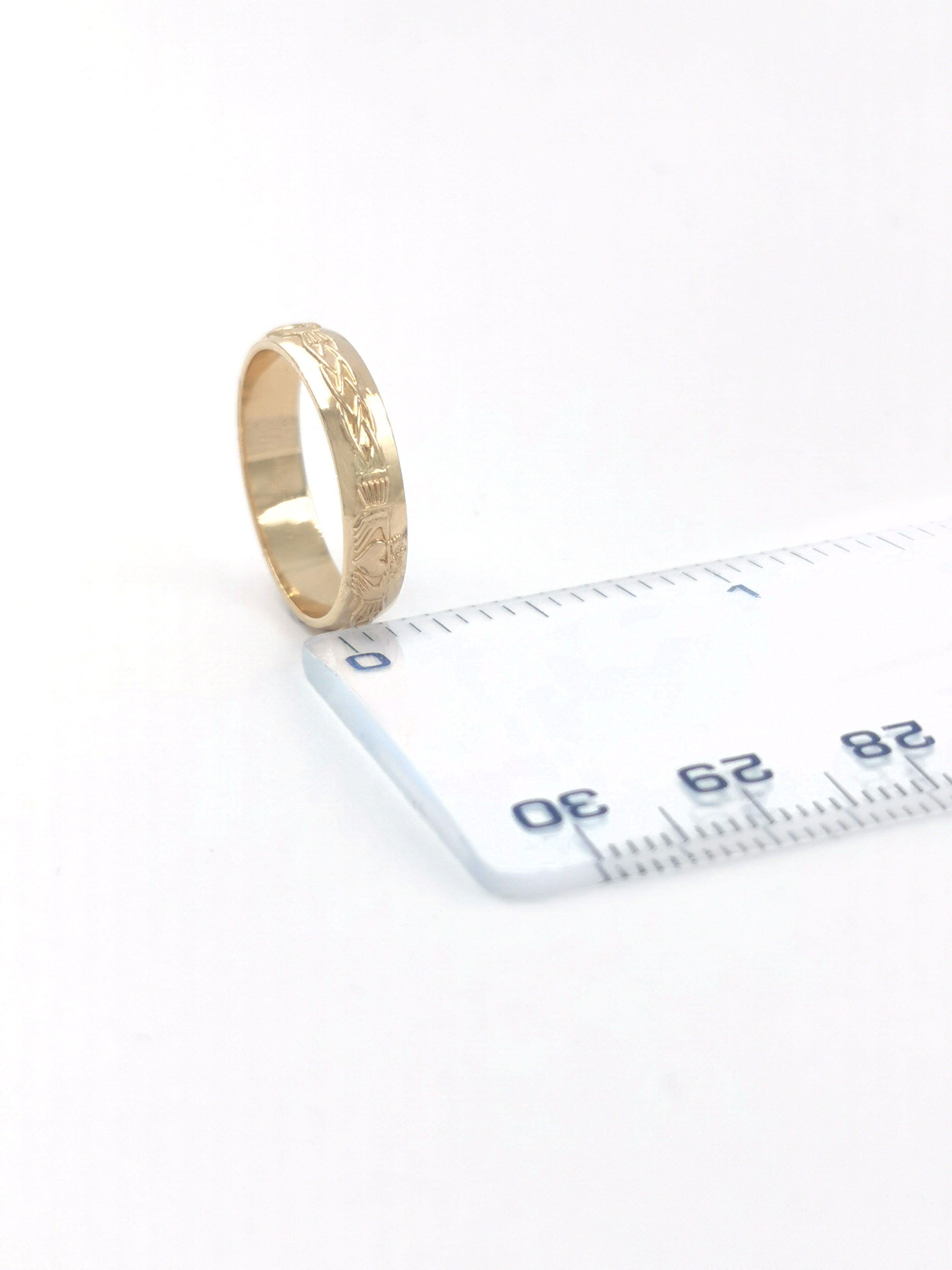 Womens Claddagh & Celtic Knot Wedding Ring in Yellow Gold. Picture For Scale.