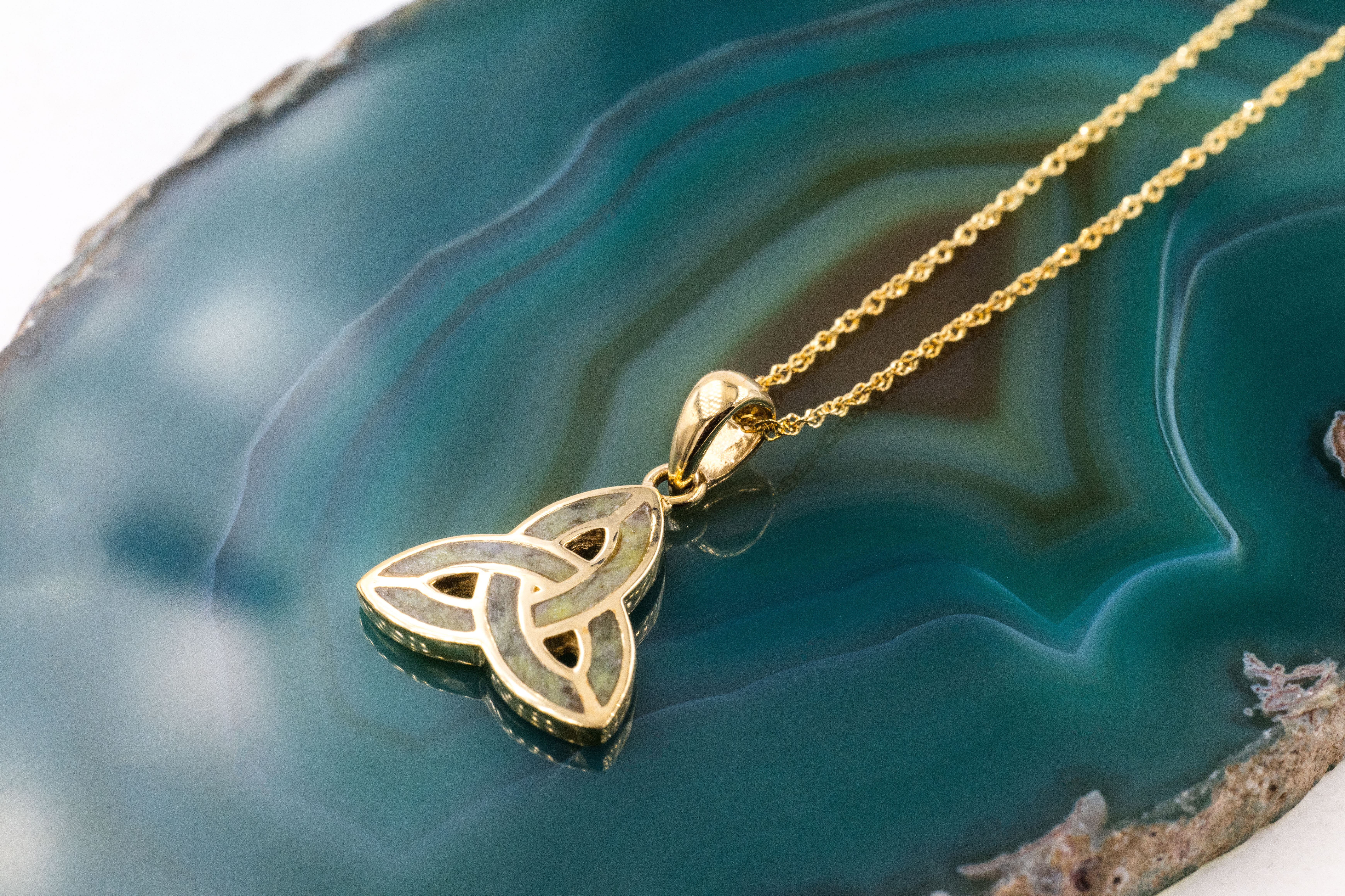 Womens Yellow Gold Connemara Marble & Trinity Knot Necklace. Pictured Flat.