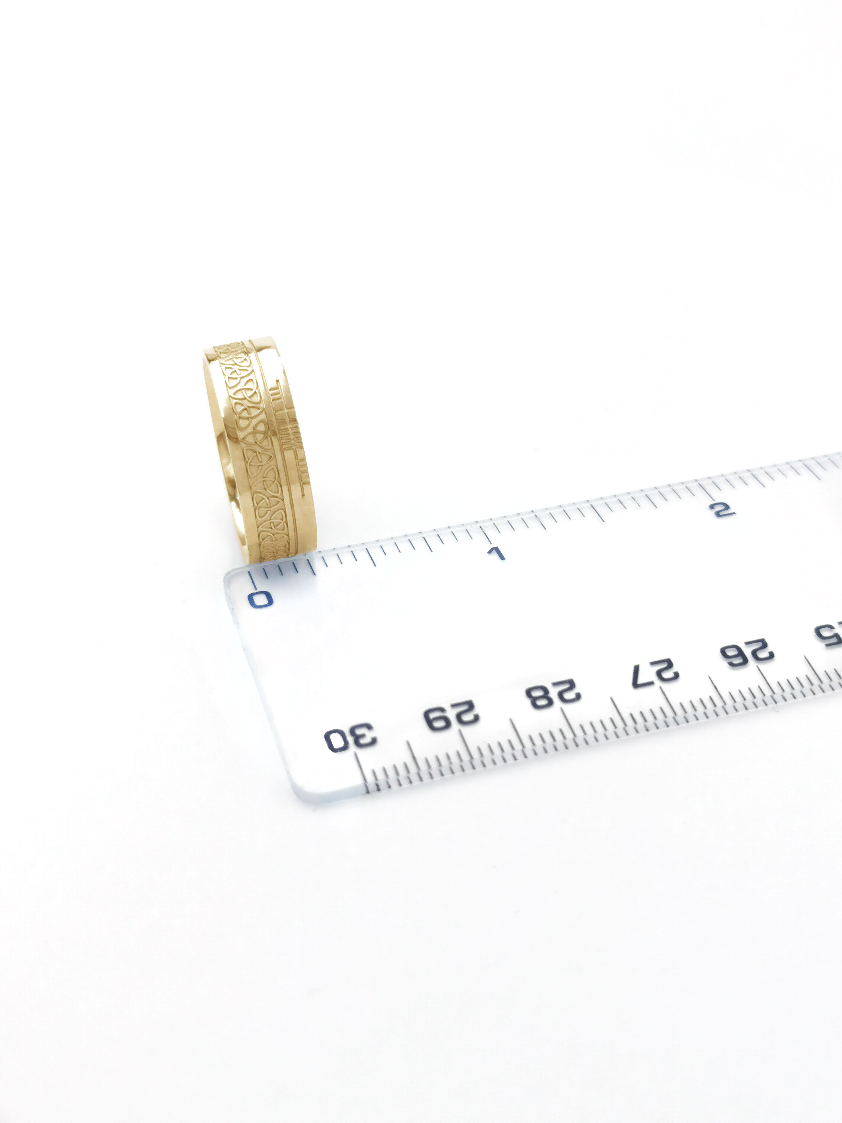 Attractive Yellow Gold Ogham & Trinity Knot 7.3mm Ring With a Florentine Finish. Picture For Scale.