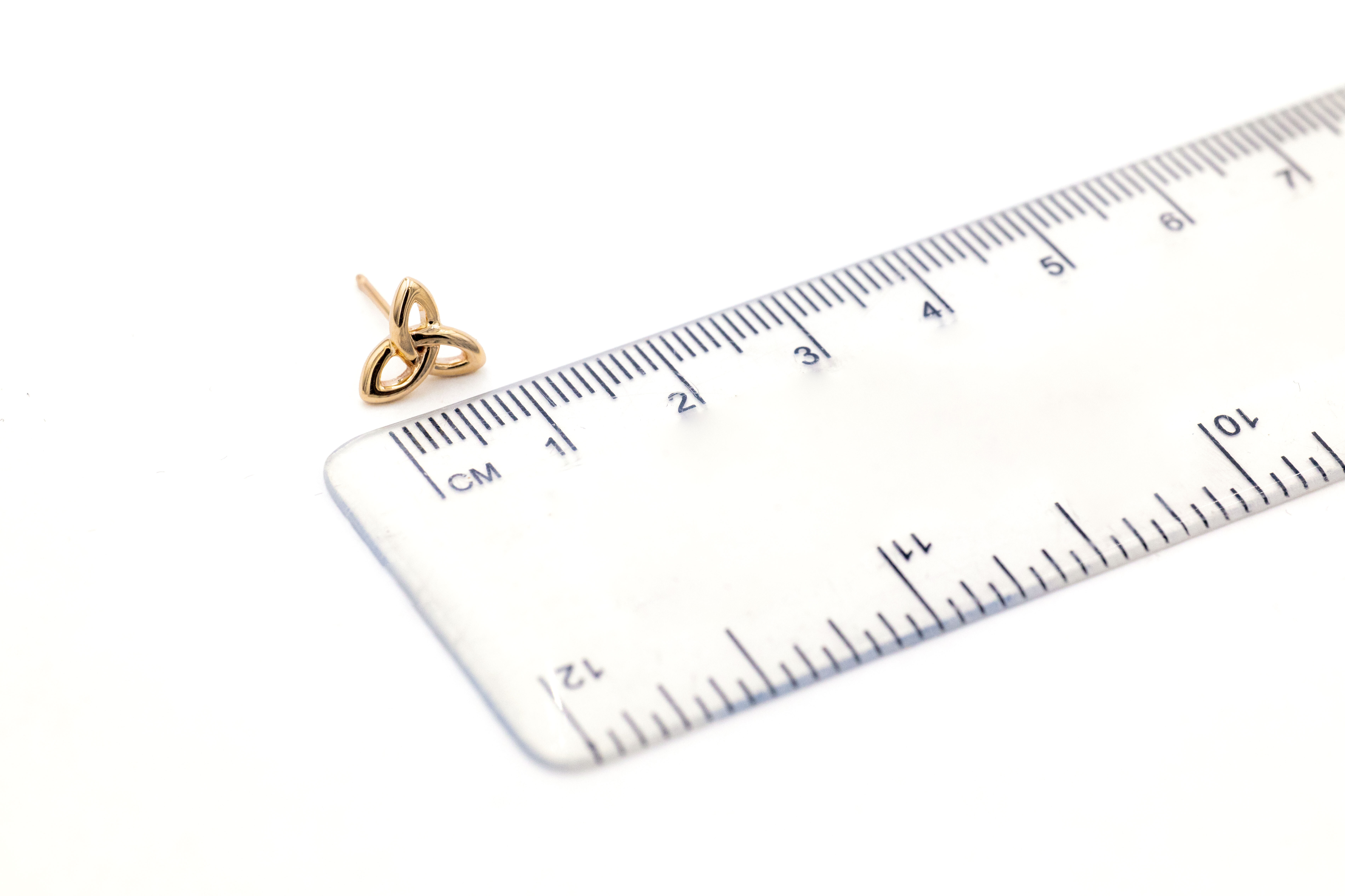 Womens Trinity Knot Earrings in Yellow Gold. Picture For Scale.