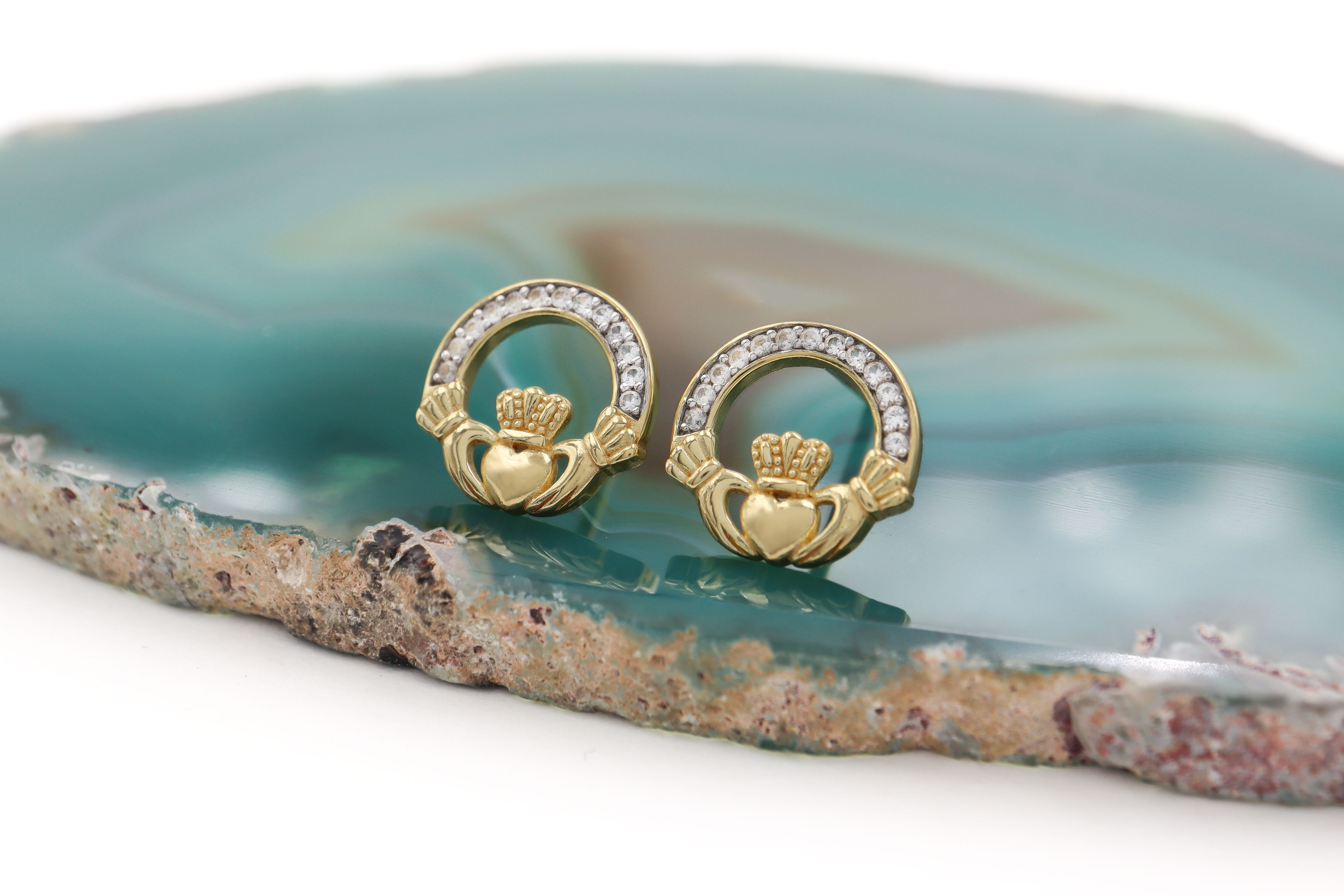 Gold Vermeil Claddagh Earrings Sku 25159 on rock