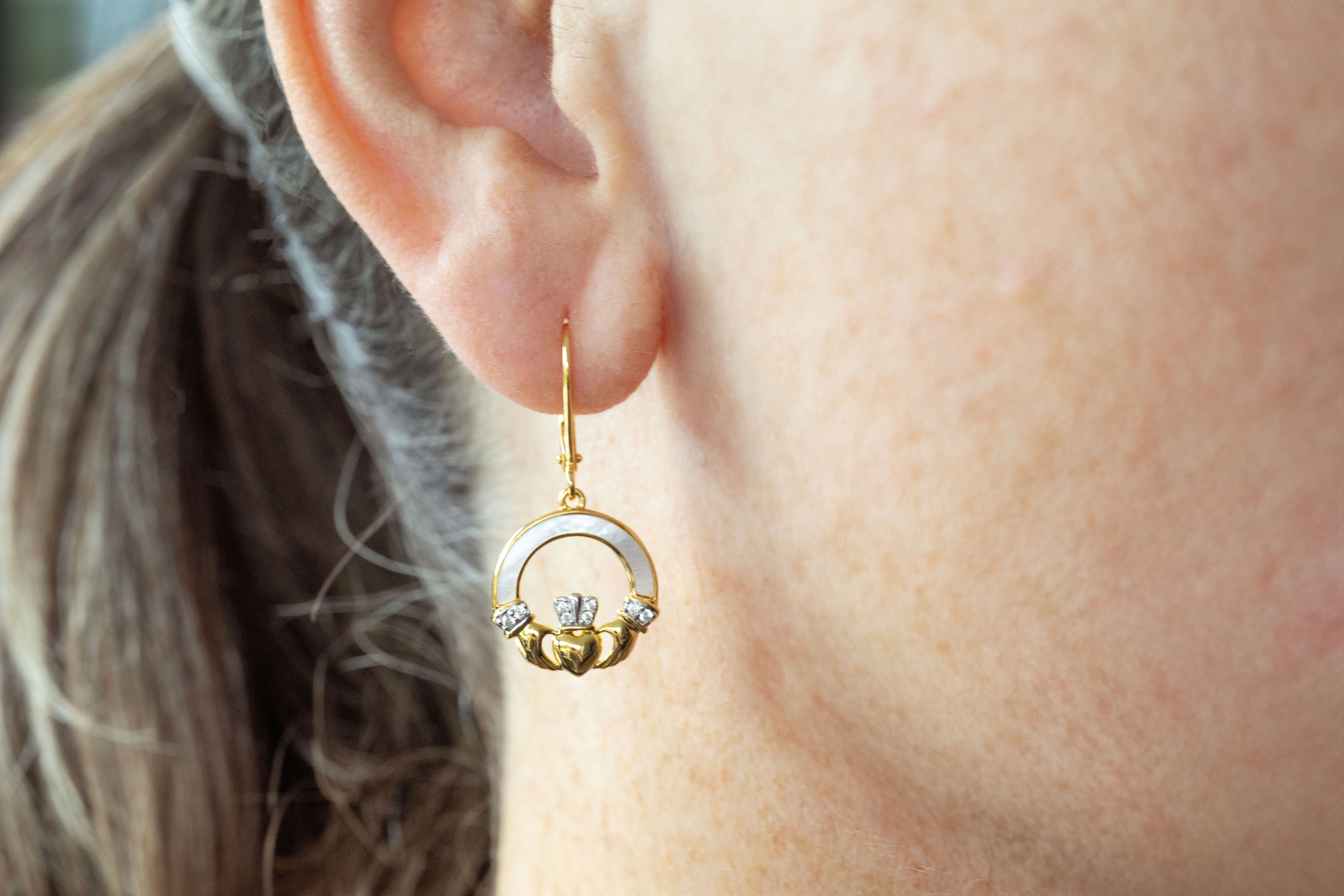 Striking Gold Vermeil Claddagh Earrings For Women - Model Photo