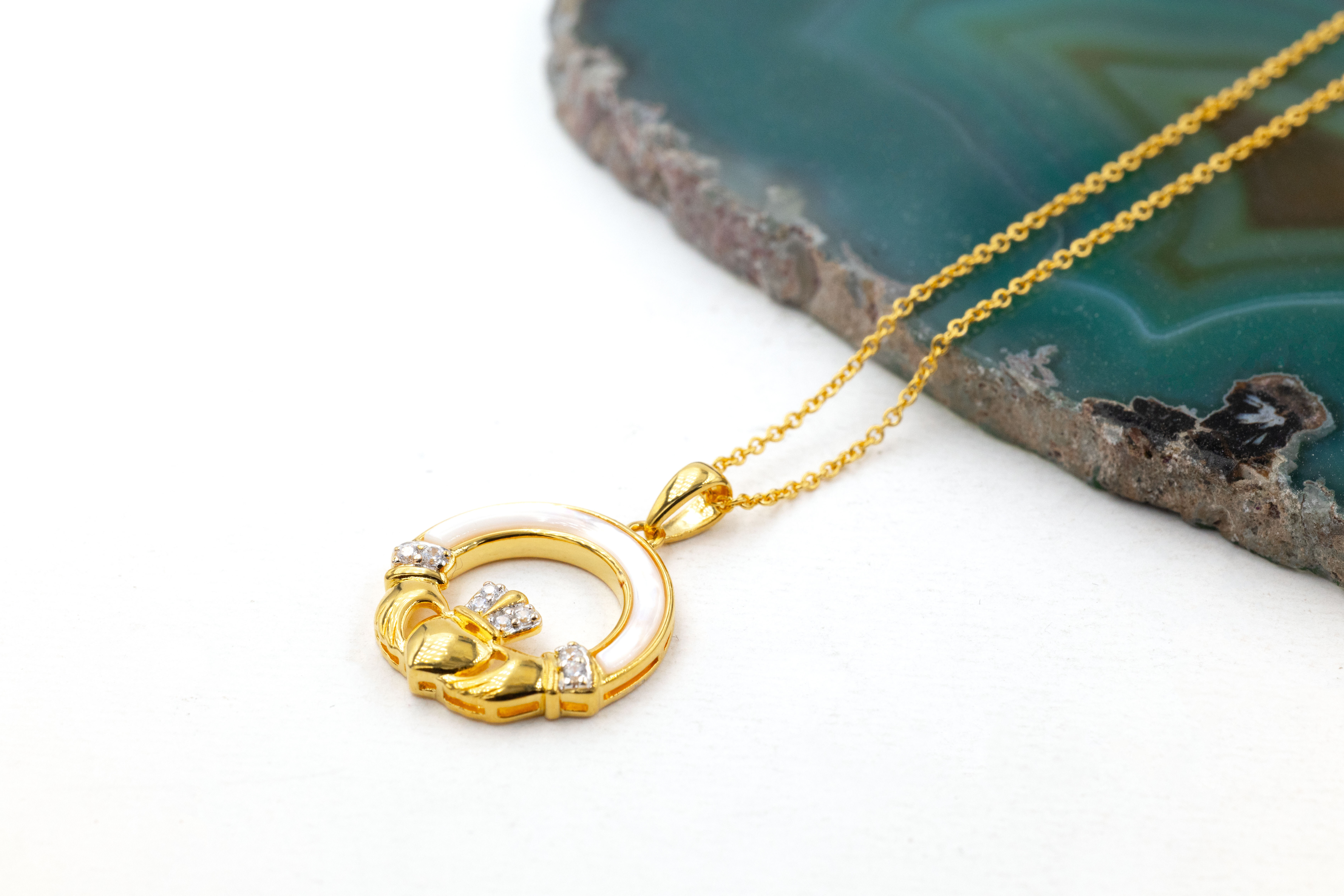 Gold Vermeil Claddagh Necklace. Pictured Flat.