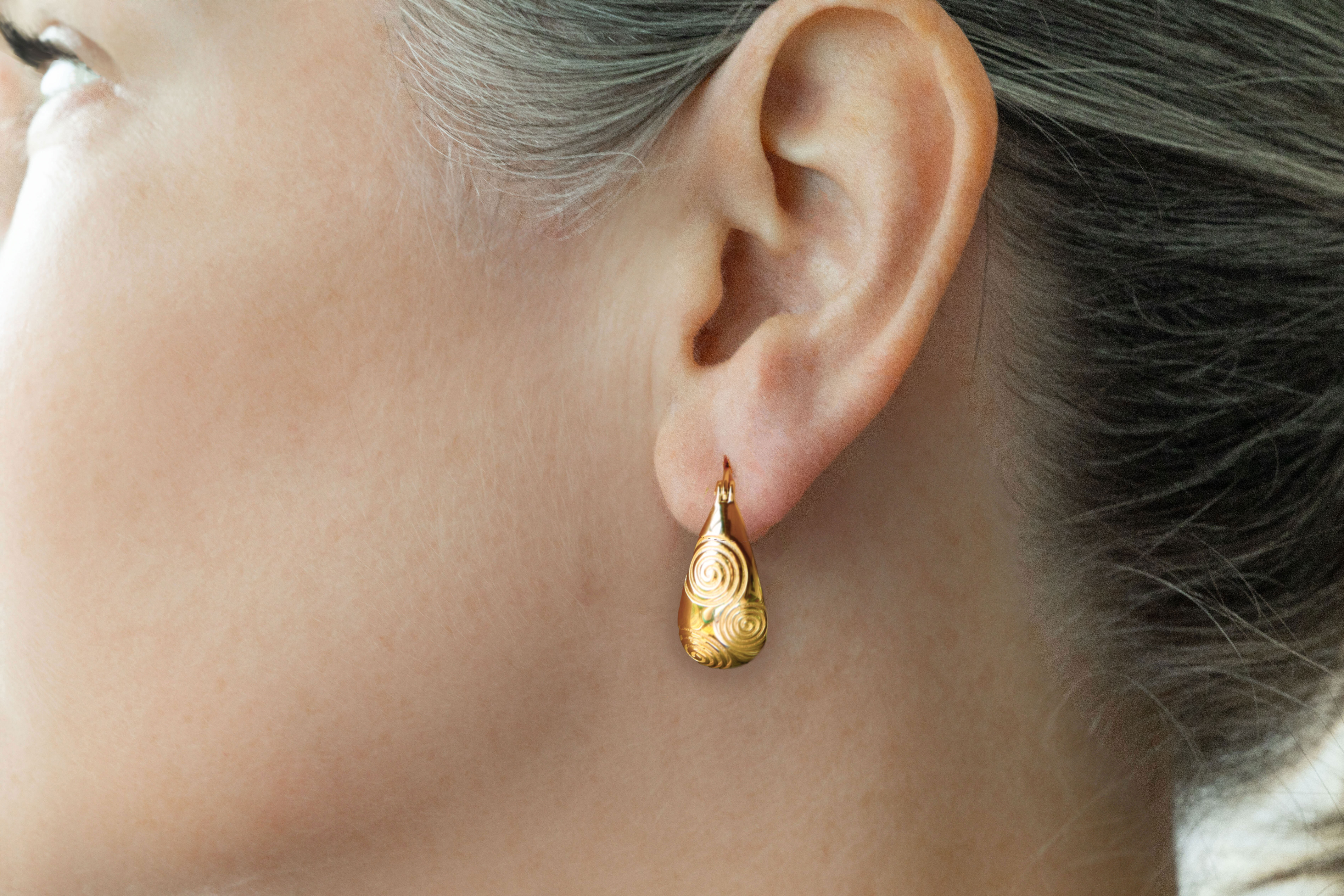 Authentic Gold Vermeil Newgrange & Triskele Earrings With a Polished Finish For Women - Model Photo