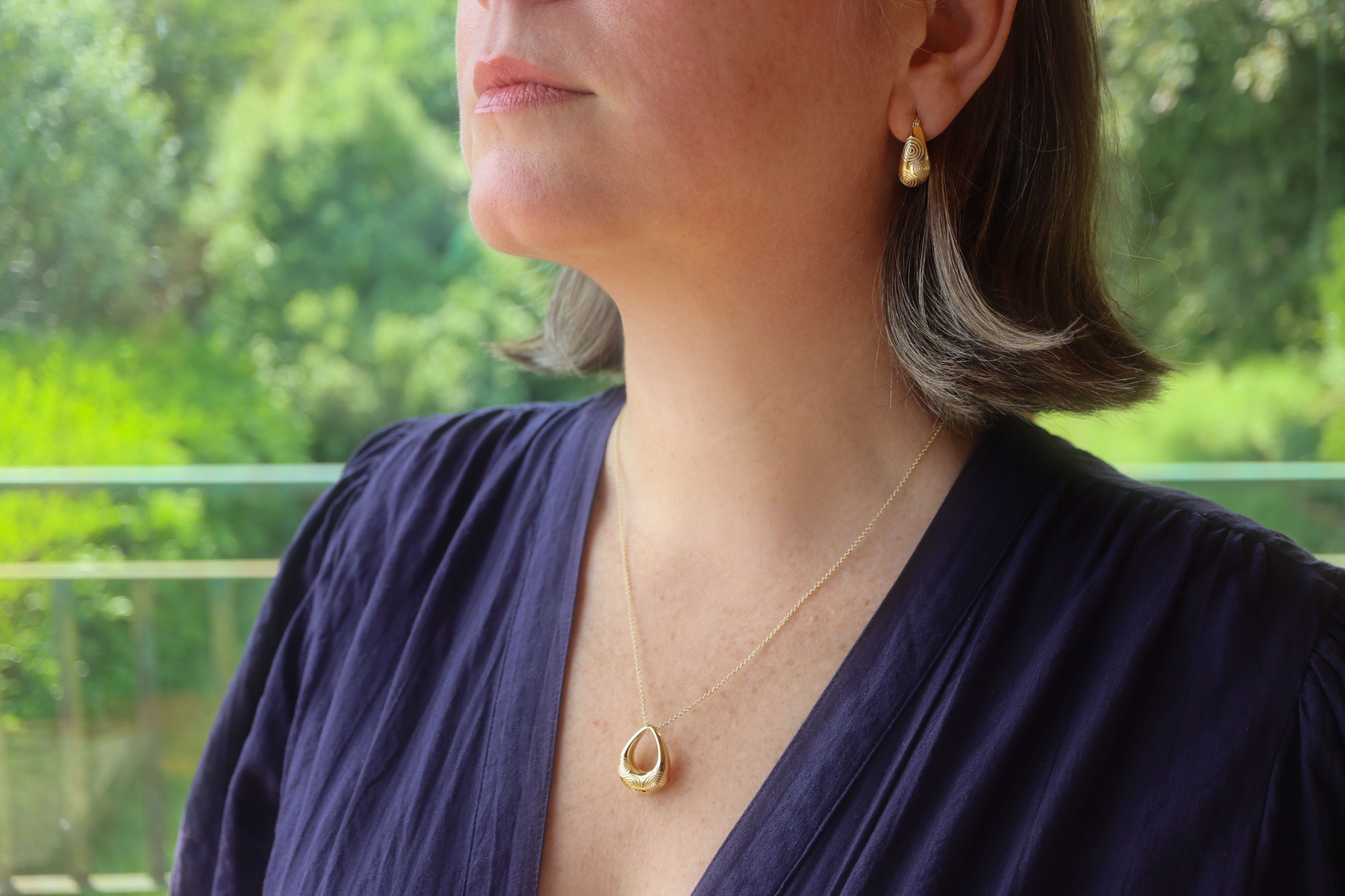 Womens Triskele & Newgrange Gift Set in Gold Vermeil With a Polished Finish - Model Photo