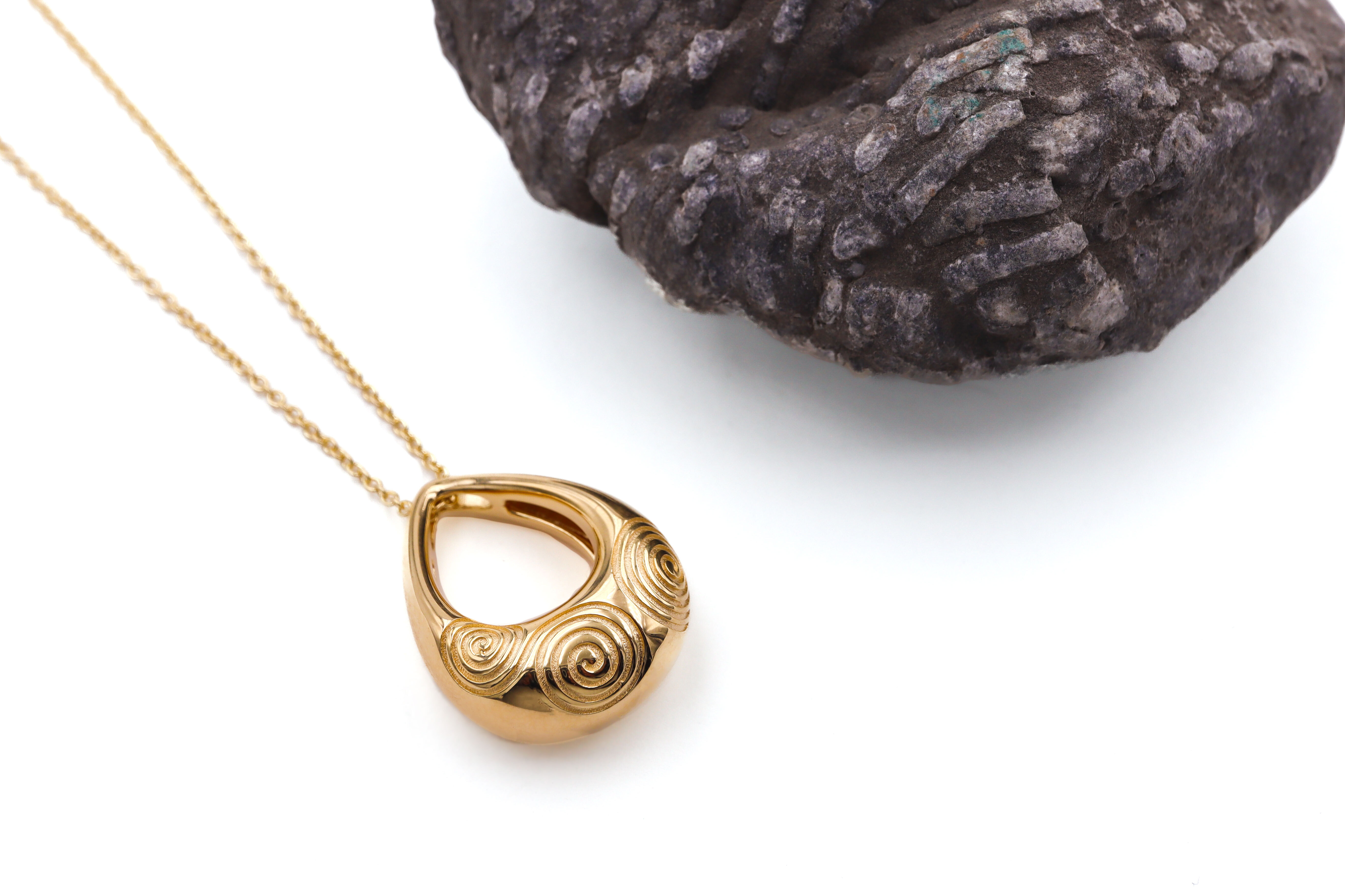 Striking Gold Vermeil Triskele Necklace For Women With a Polished Finish. Pictured Flat.
