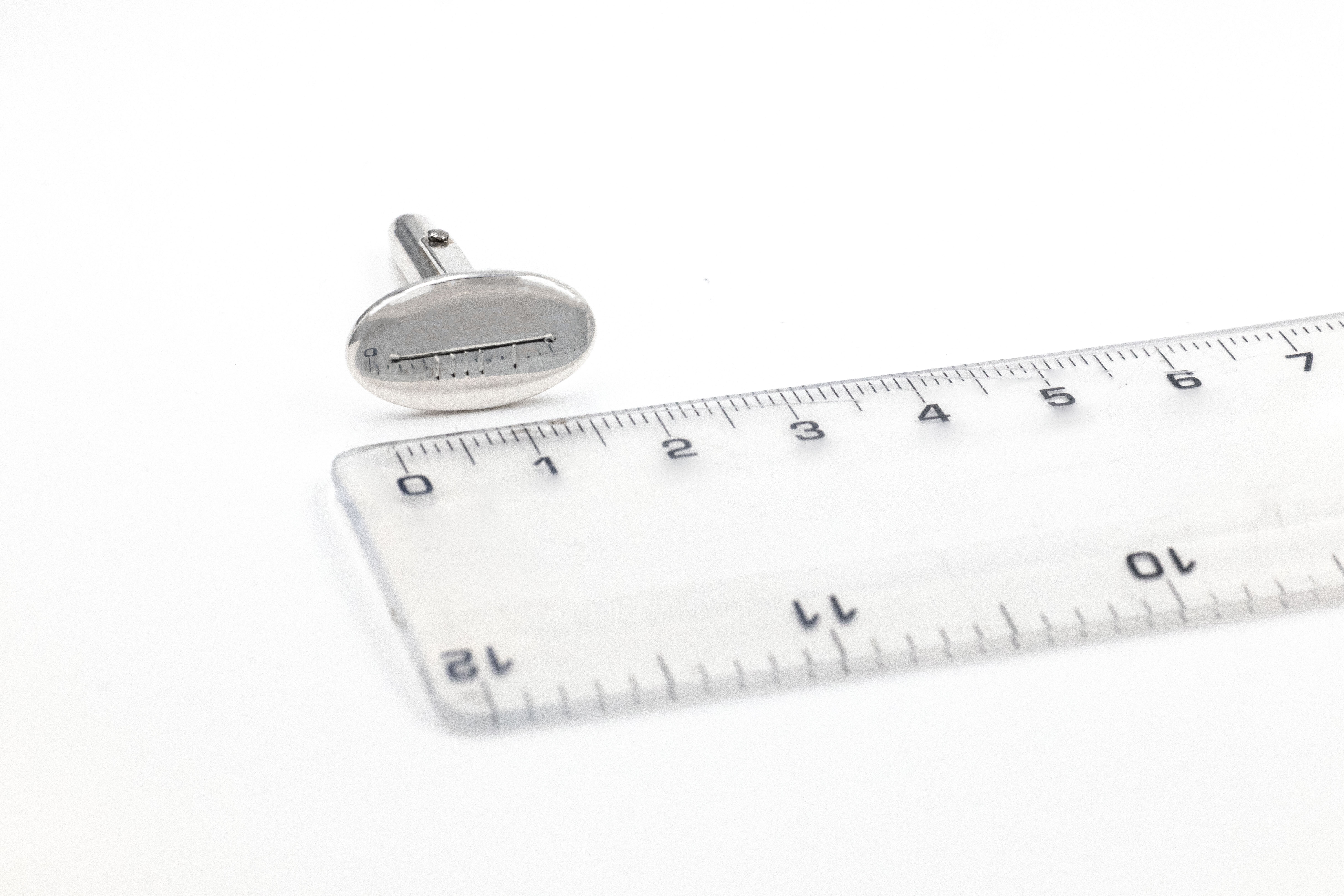 Gaelic Cufflinks - An oval cufflink hand engraved with letters S and B in ogham