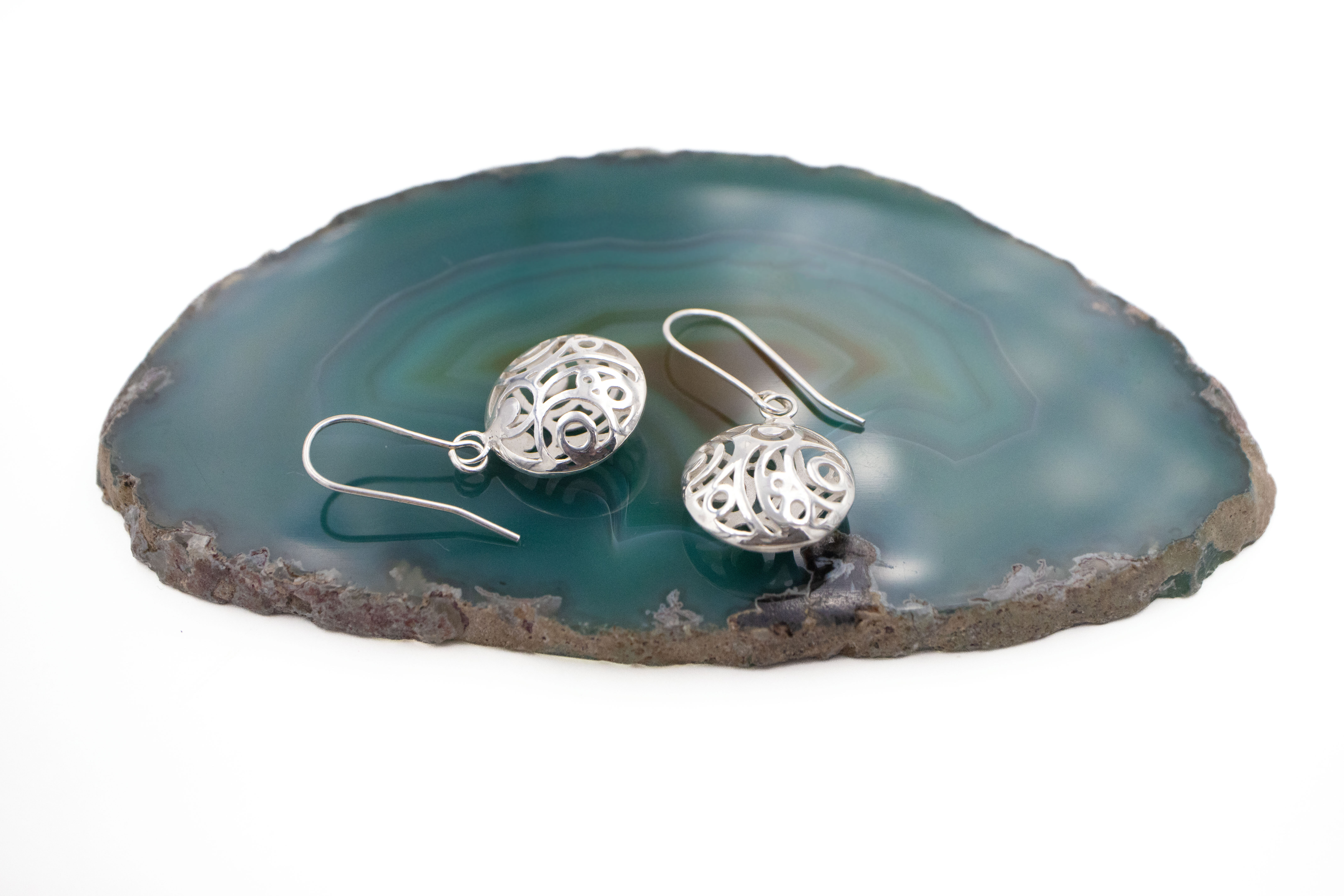 Gorgeous Sterling Silver Folklore Earrings For Women With a Polished Finish. Side View.