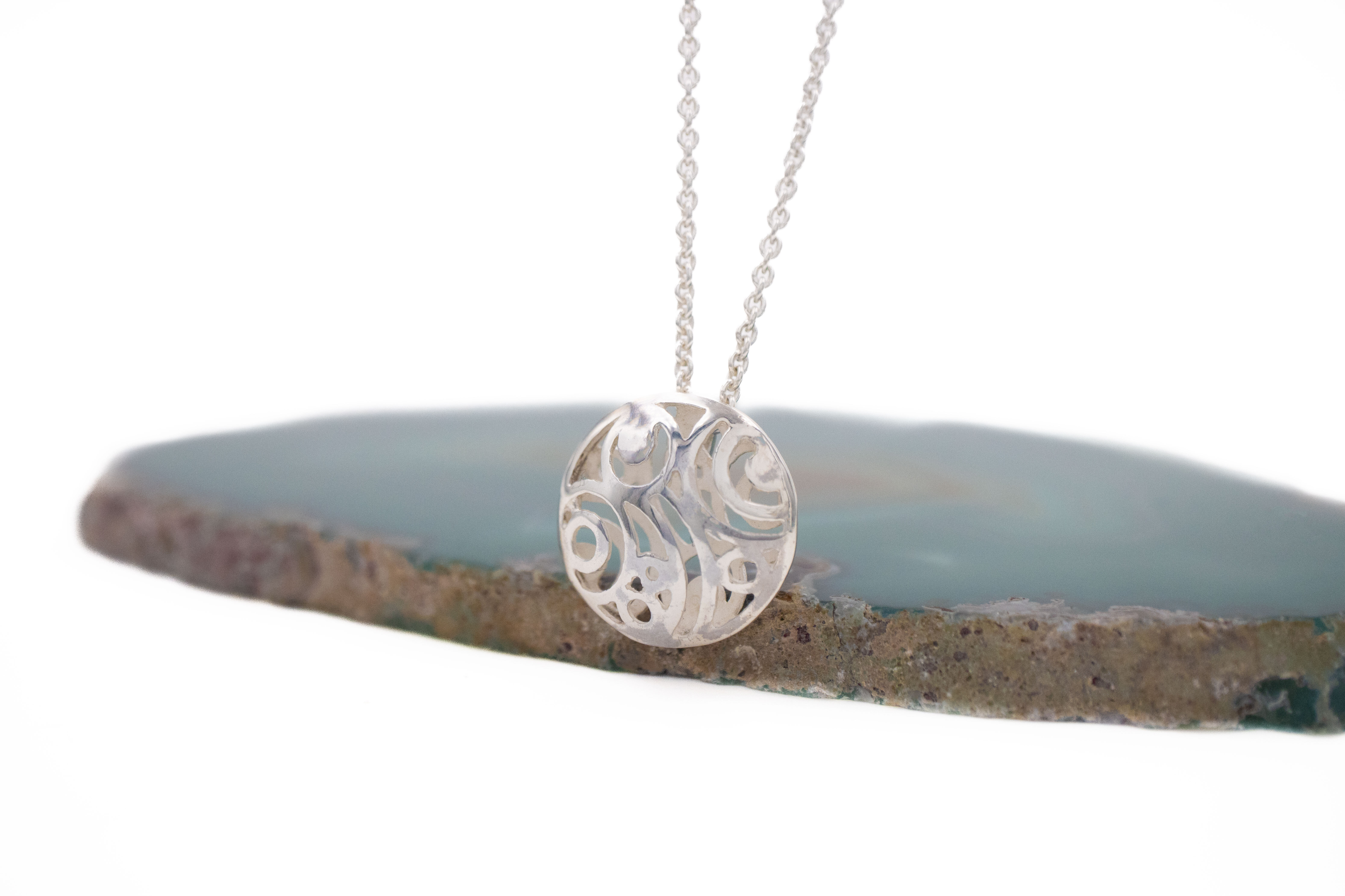Womens Polished Sterling Silver Newgrange Necklace. Side View.