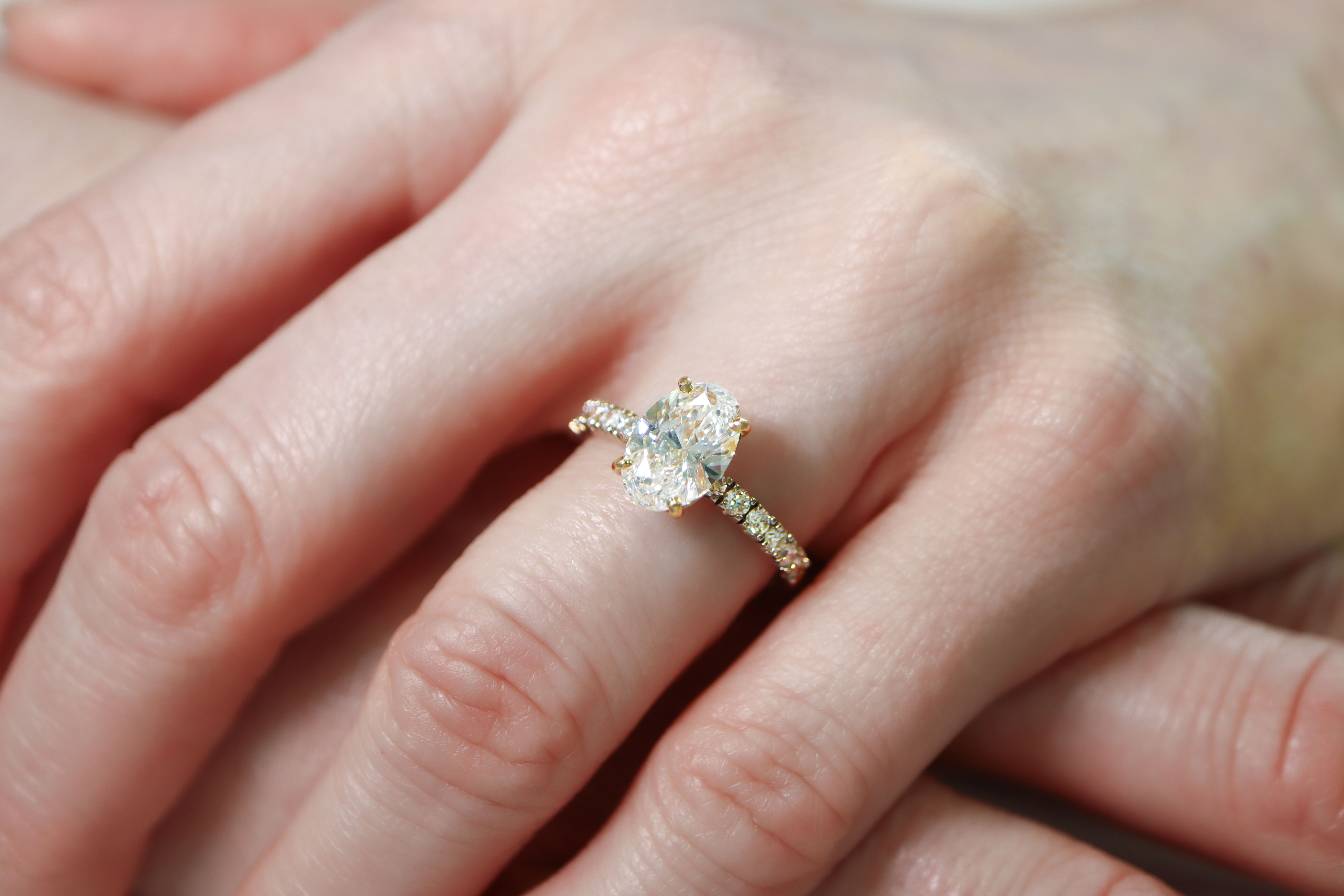 Luxurious Yellow Gold Trinity Knot Ring For Women With a Polished Finish - Model Photo