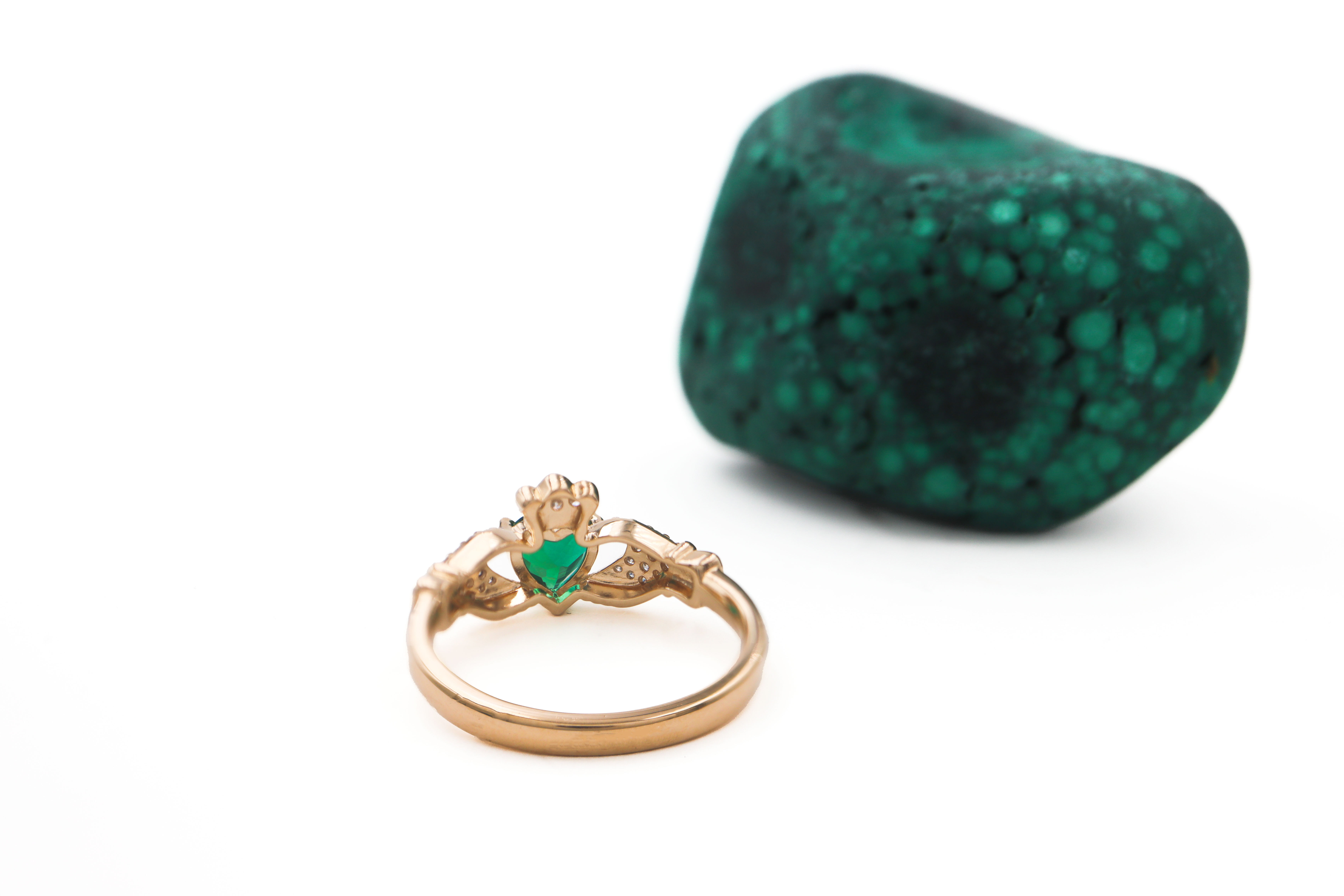 Gorgeous 14K Yellow Gold Claddagh 0.70ct Lab Grown Emerald Engagement Ring For Women With a Polished Finish. Picture Of The Back.