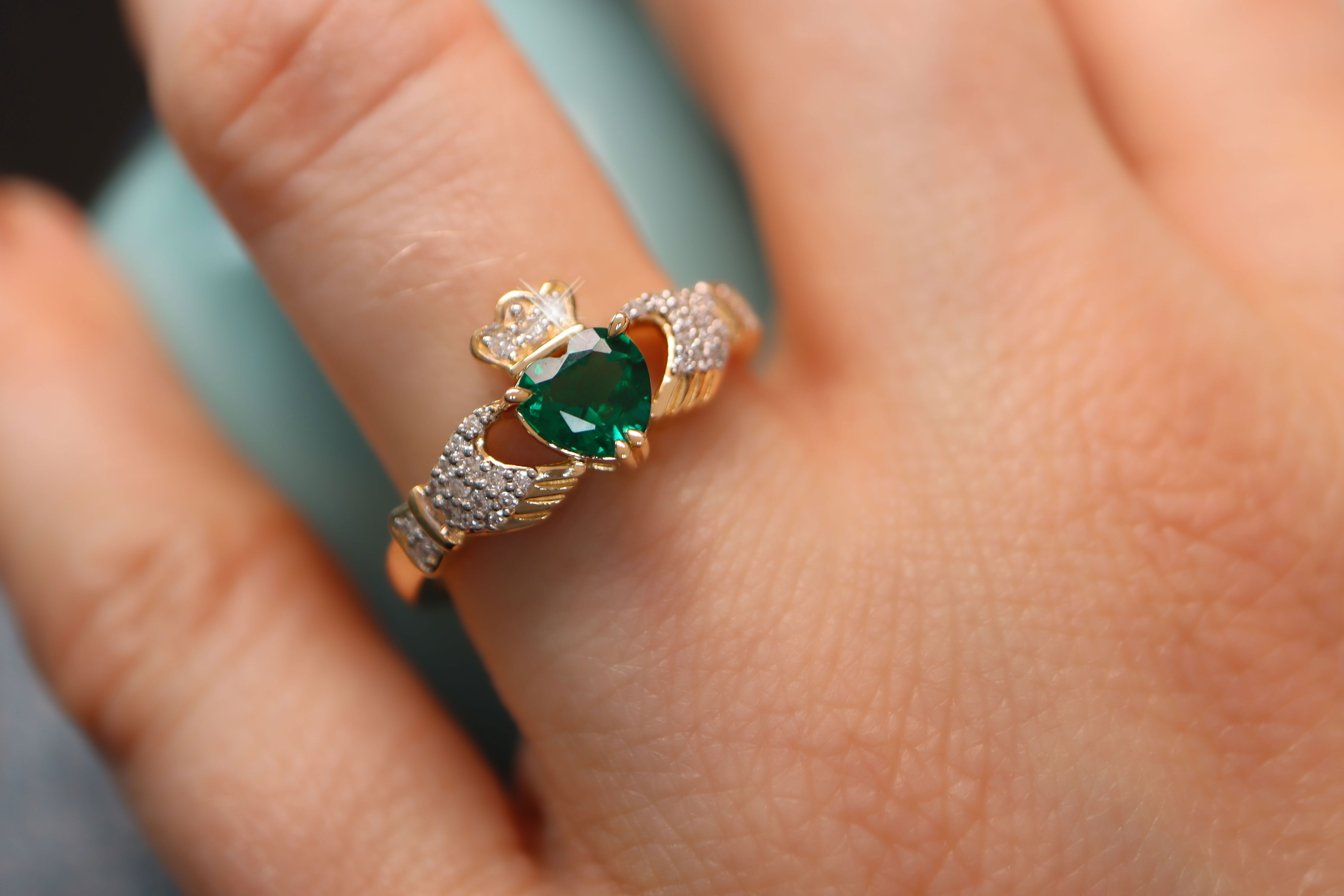 Striking Yellow Gold Claddagh 0.70ct Lab Grown Emerald Engagement Ring With a Polished Finish For Women - Model Photo