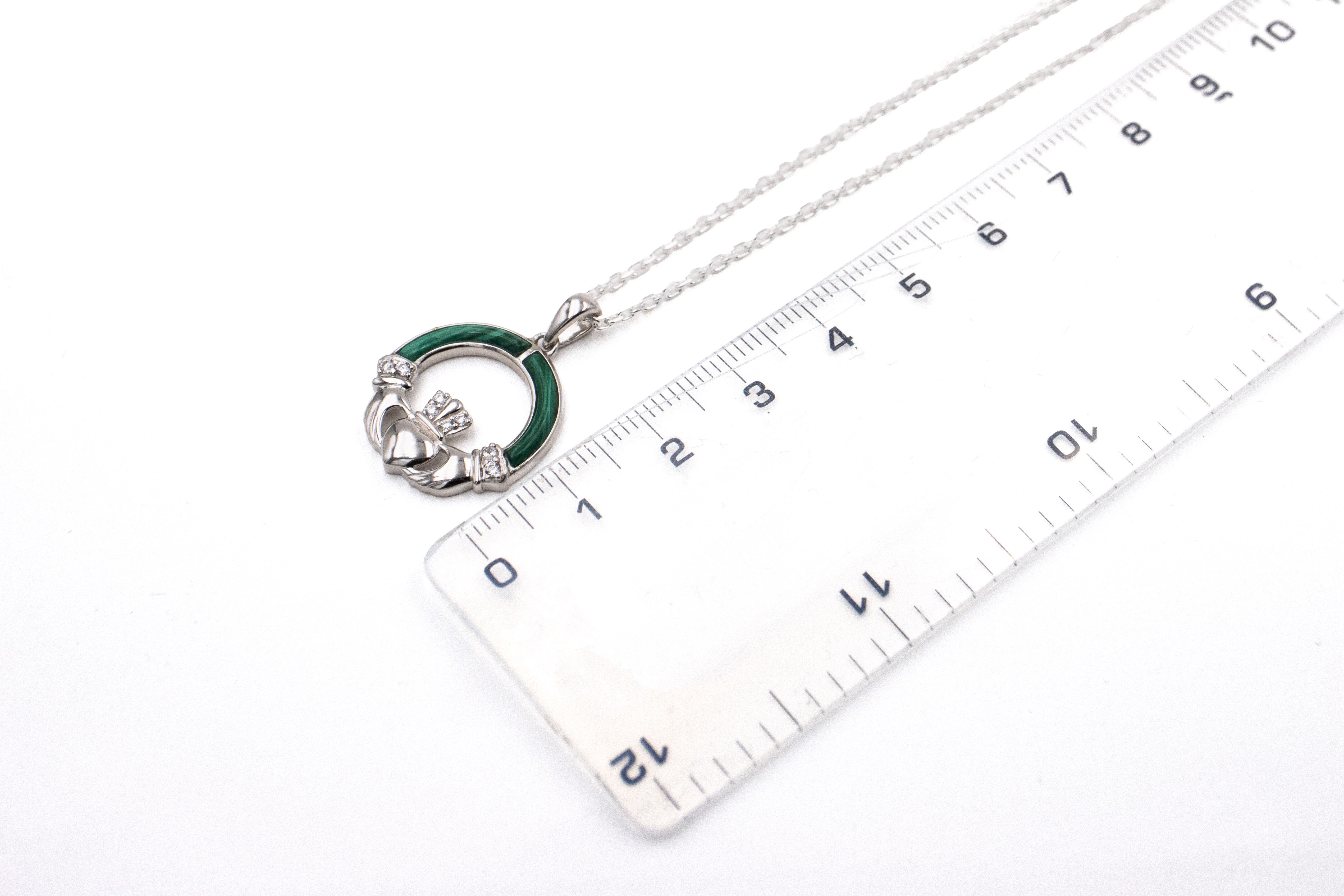 Womens Claddagh Necklace in Sterling Silver With a Polished Finish. Picture For Scale.