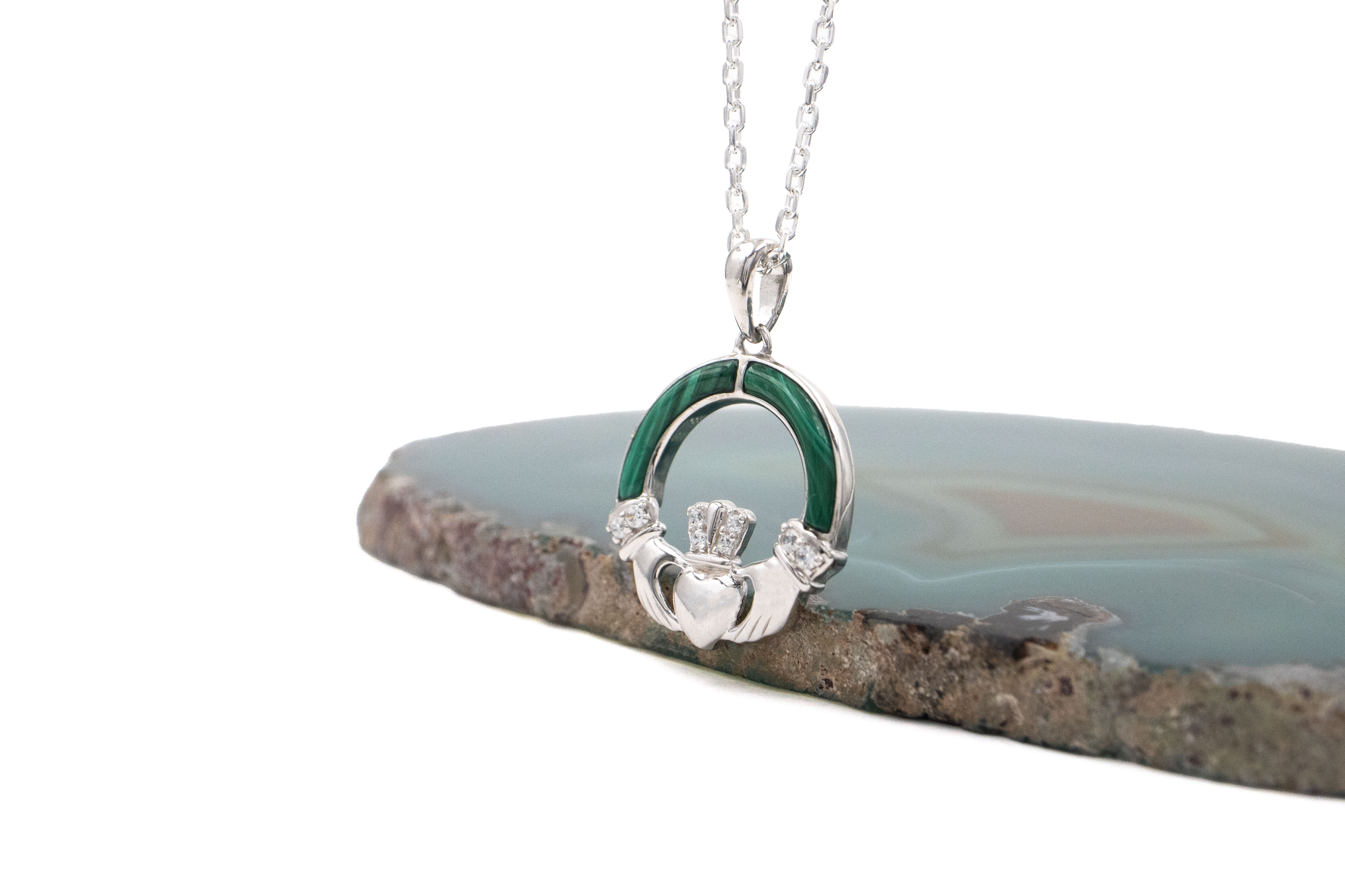 Womens Claddagh Necklace in Sterling Silver With a Polished Finish. Side View.