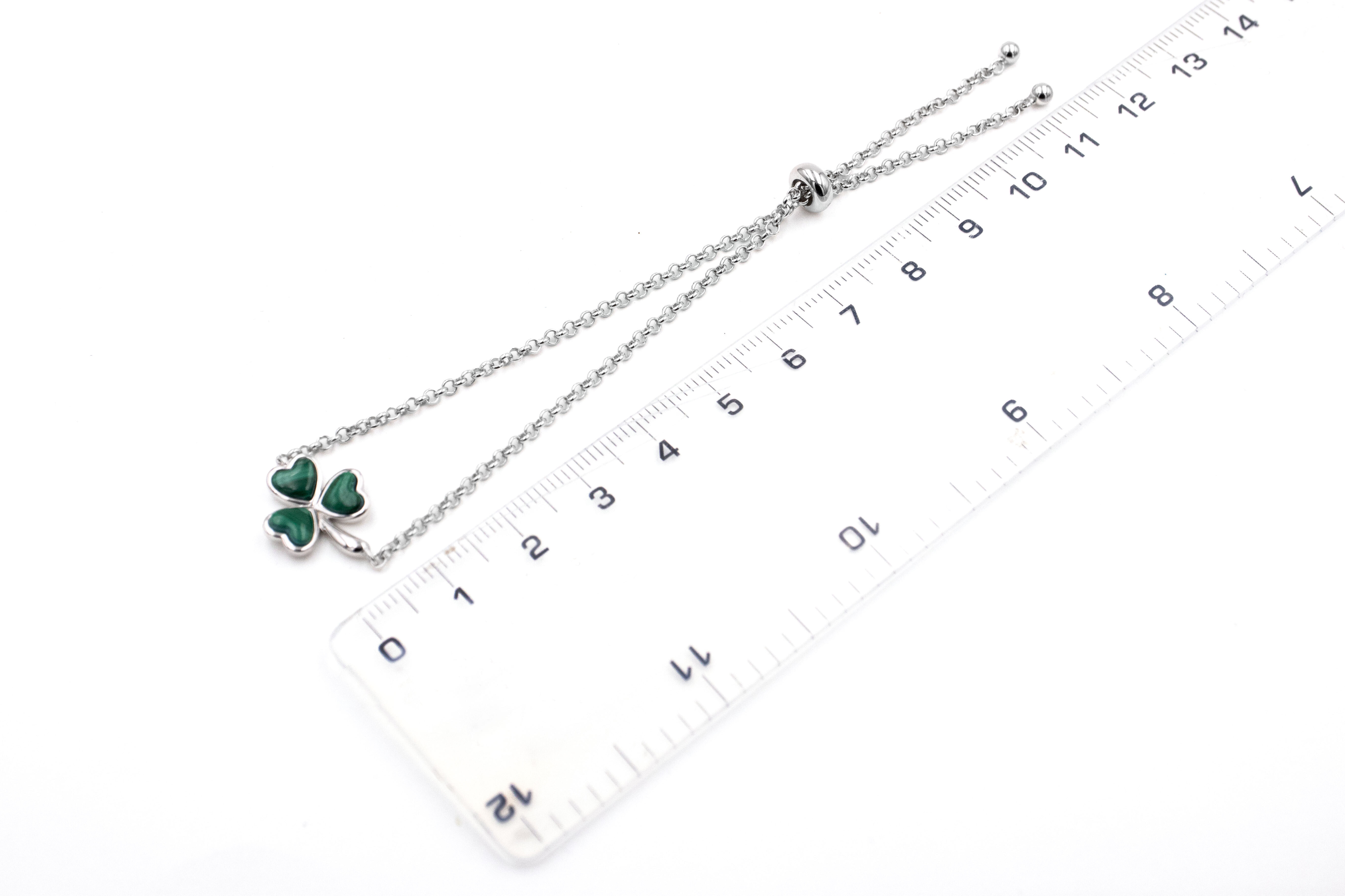 Genuine Sterling Silver Shamrock Bracelet For Women With a Polished Finish. Picture For Scale.