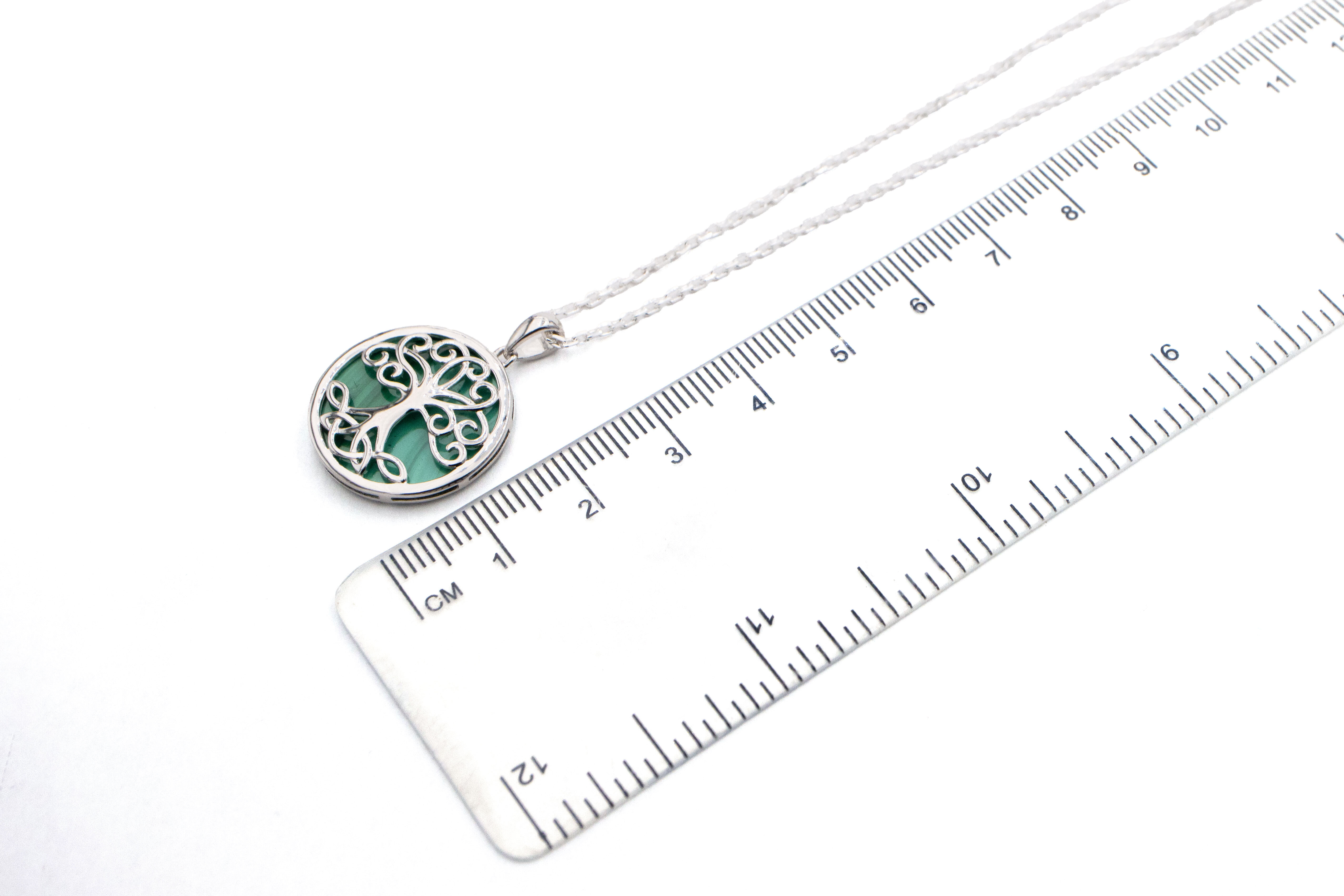 Gorgeous Sterling Silver Tree of Life Necklace With a Polished Finish For Women. Picture For Scale.