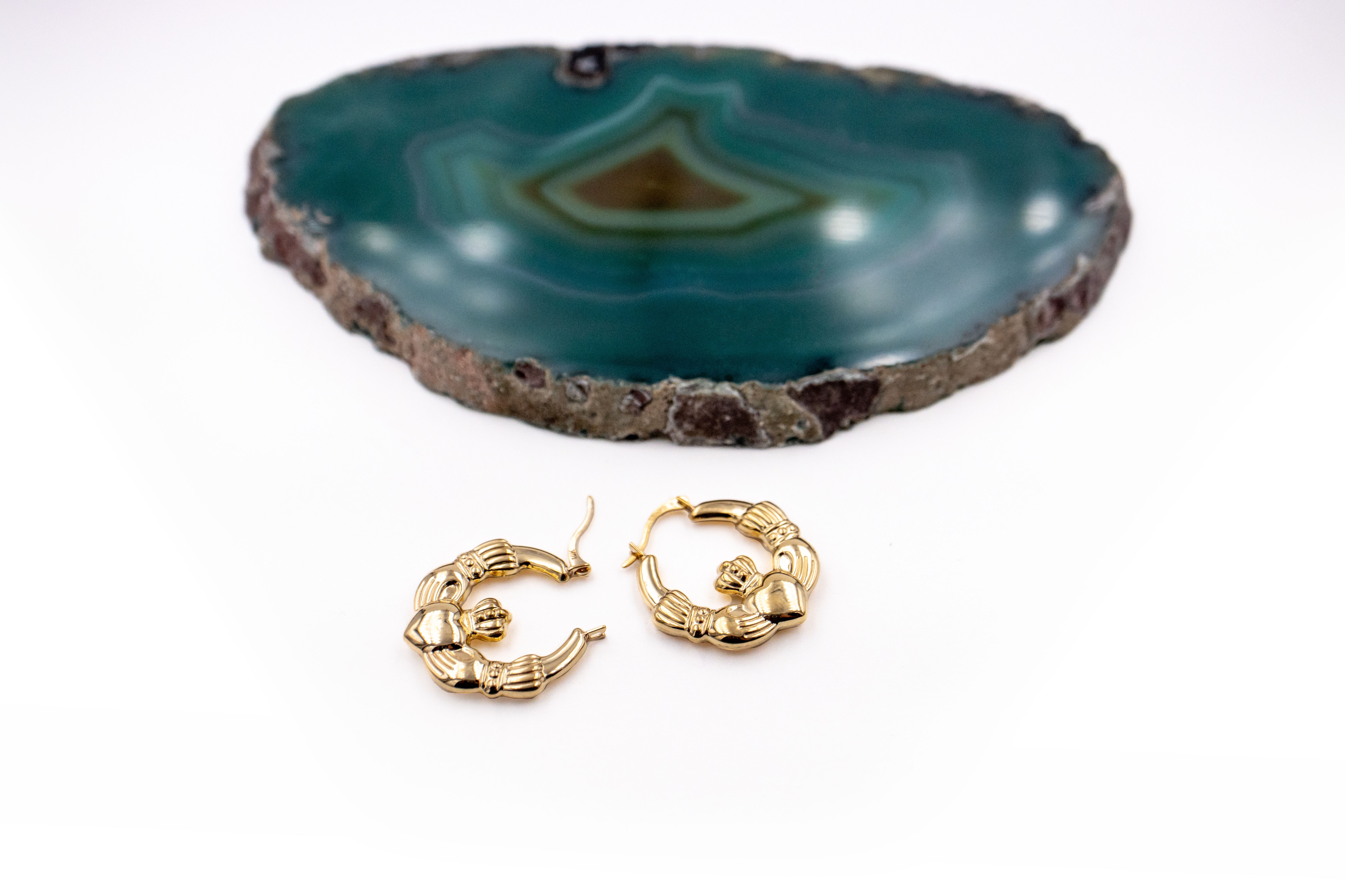 Womens Medium Sized Yellow Gold Claddagh Earrings. Side View.