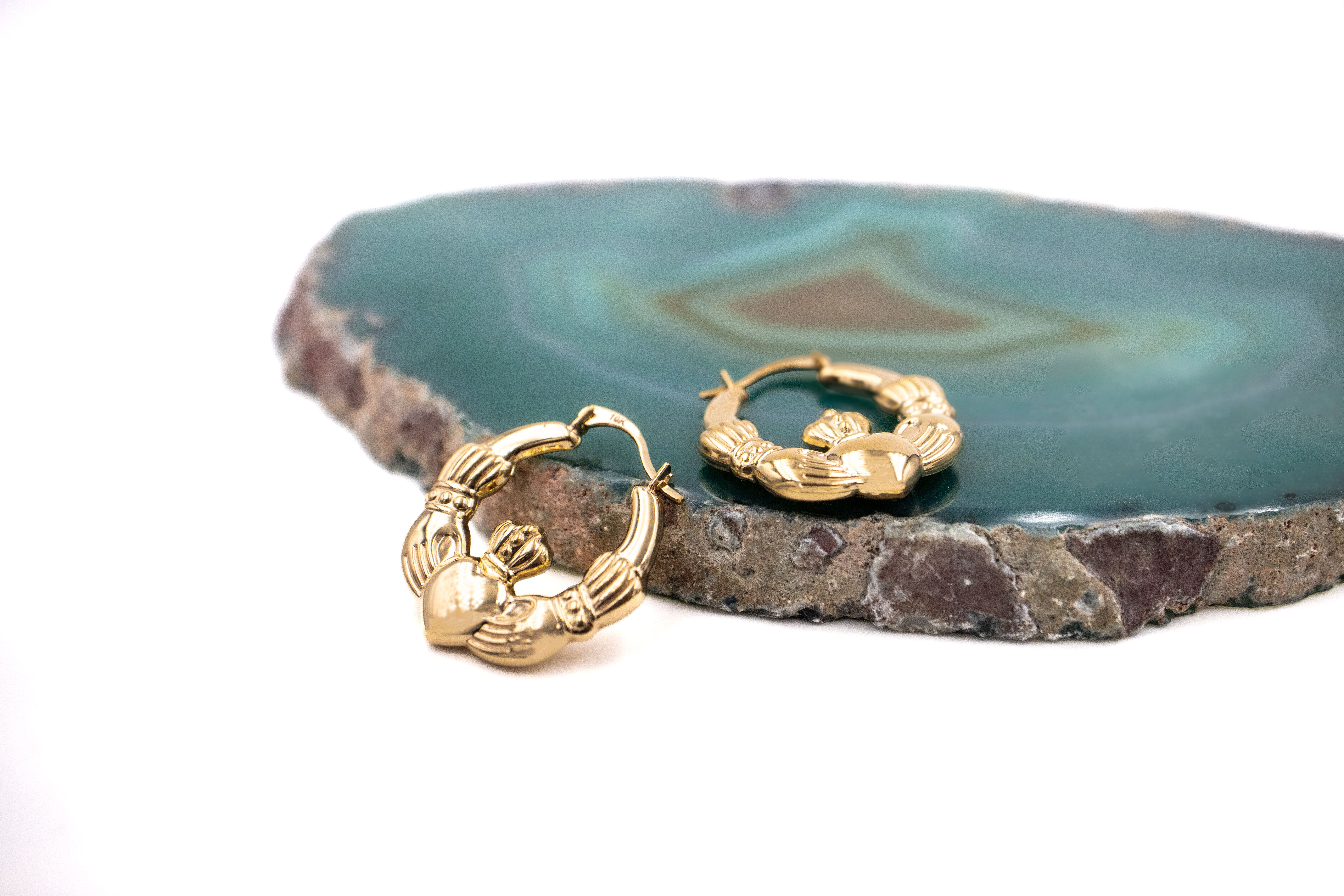 Womens Medium Sized 14K Yellow Gold Claddagh Earrings. Side View.