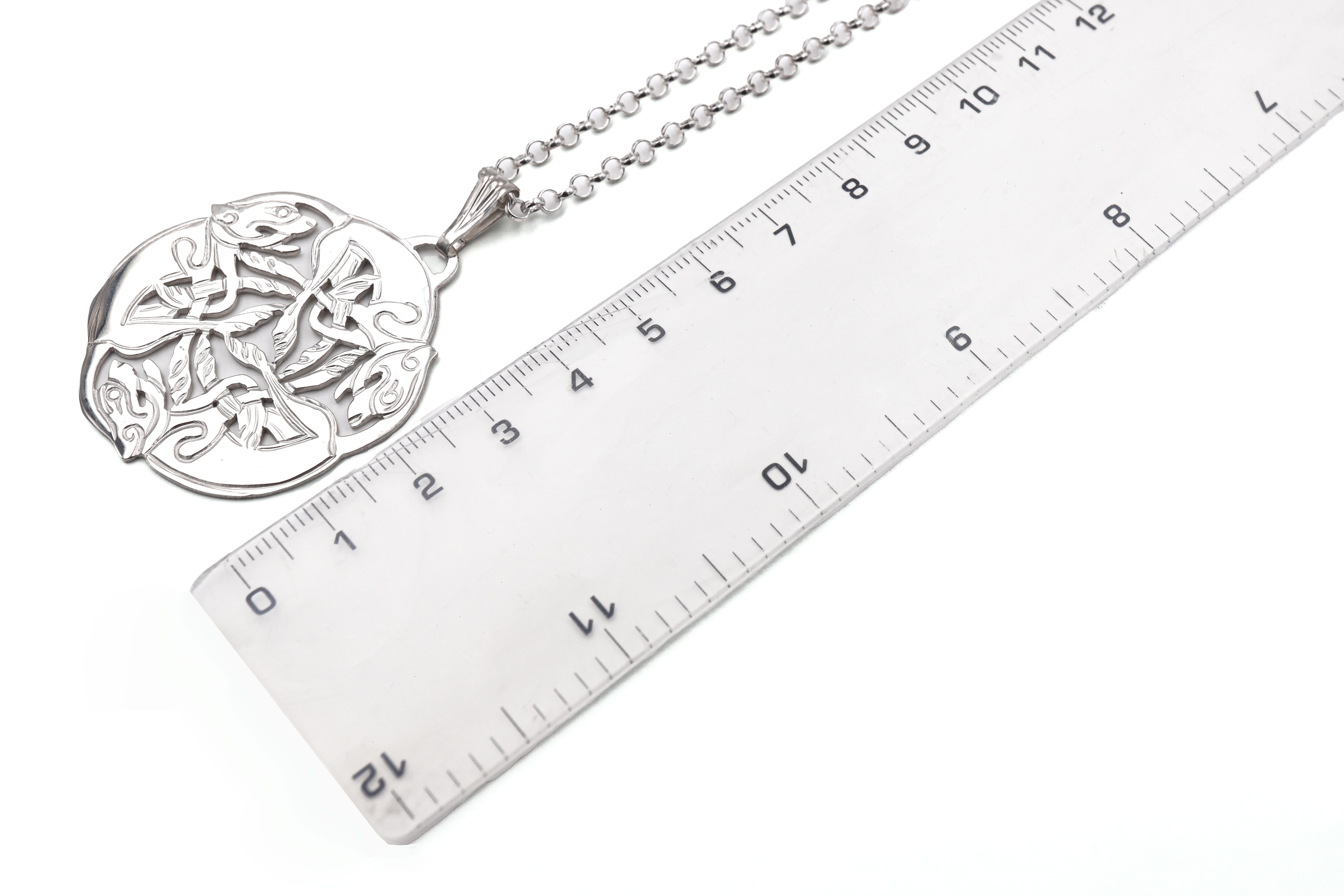 Womens Medium Sized Book of Kells Necklace in Real Sterling Silver. Picture For Scale.