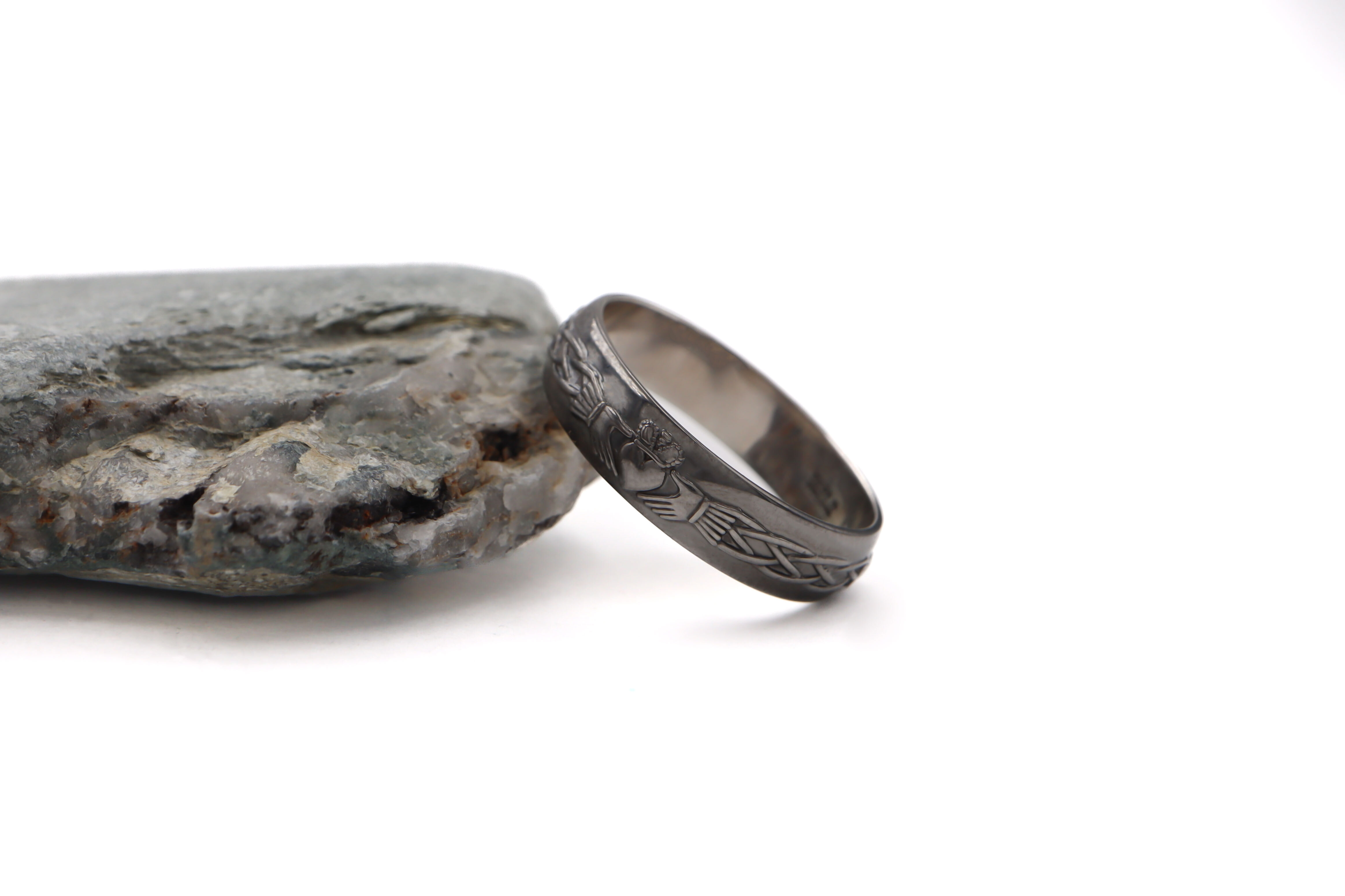 Striking White Gold Claddagh 4.5mm Ring For Men With a Black Rhodium Finish. Side View.