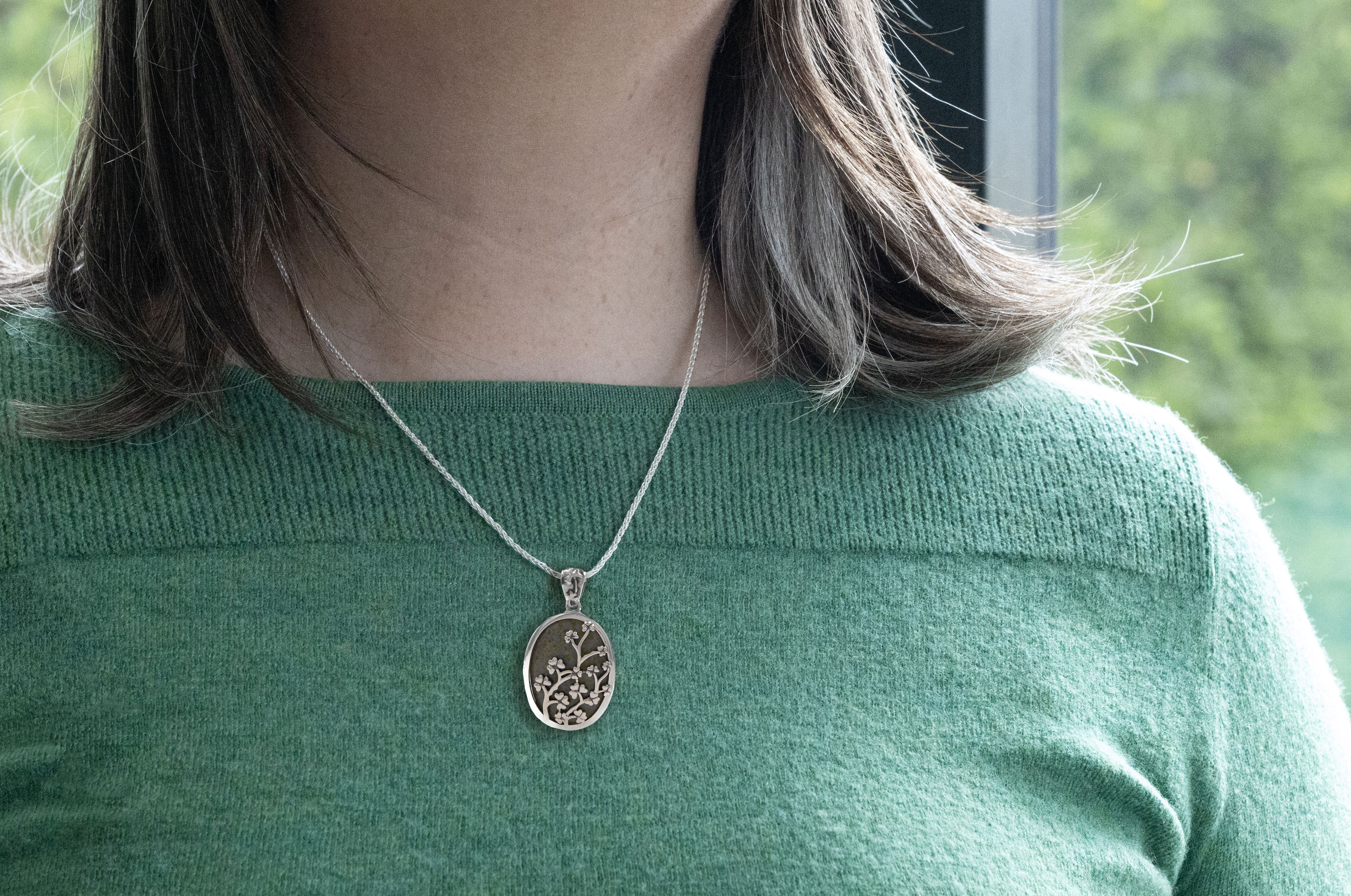 Authentic Sterling Silver Shamrock & Connemara Marble Necklace With a Polished Finish For Women - Model Photo