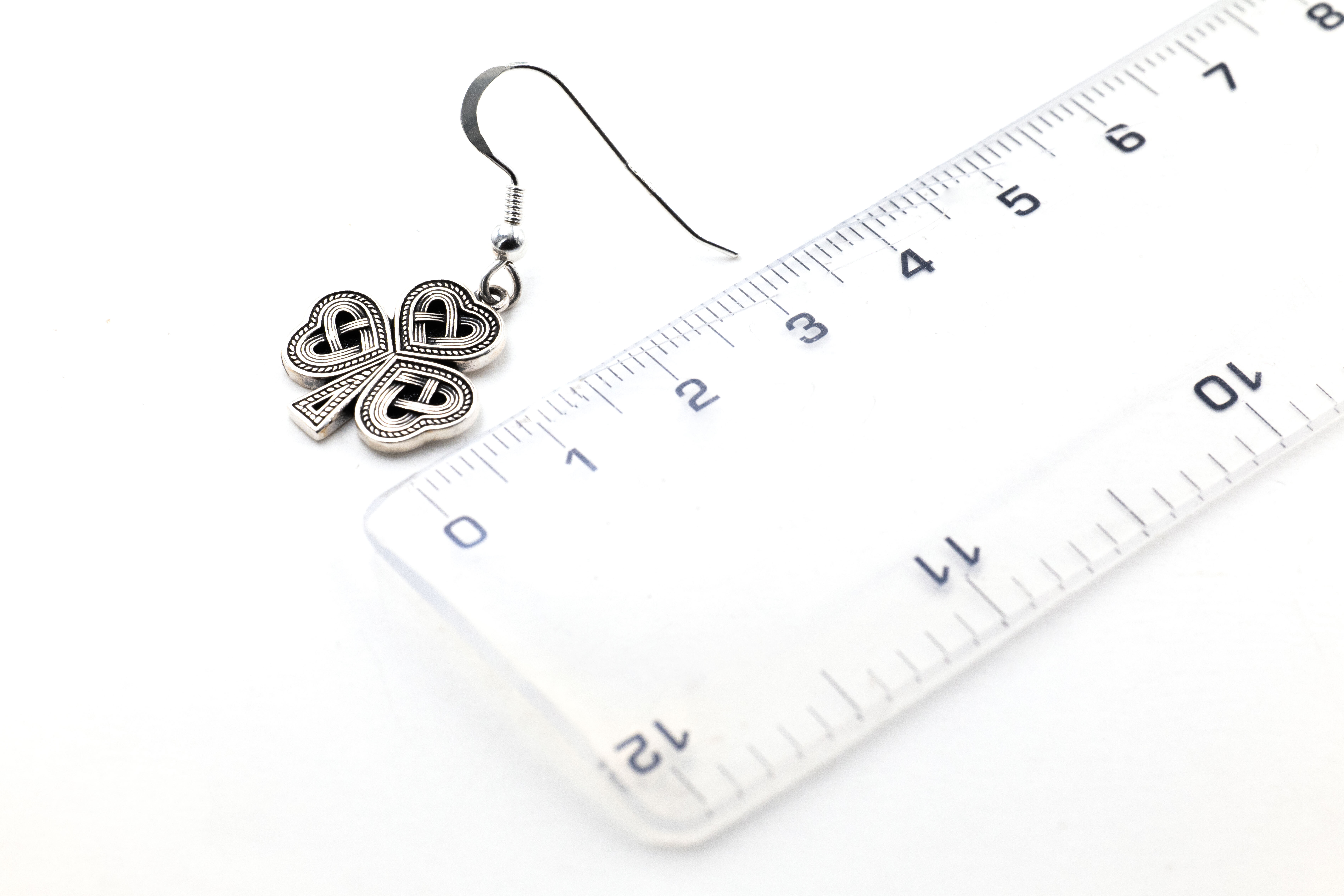Attractive Sterling Silver Shamrock Earrings With a Oxidized Finish For Women. Picture For Scale.