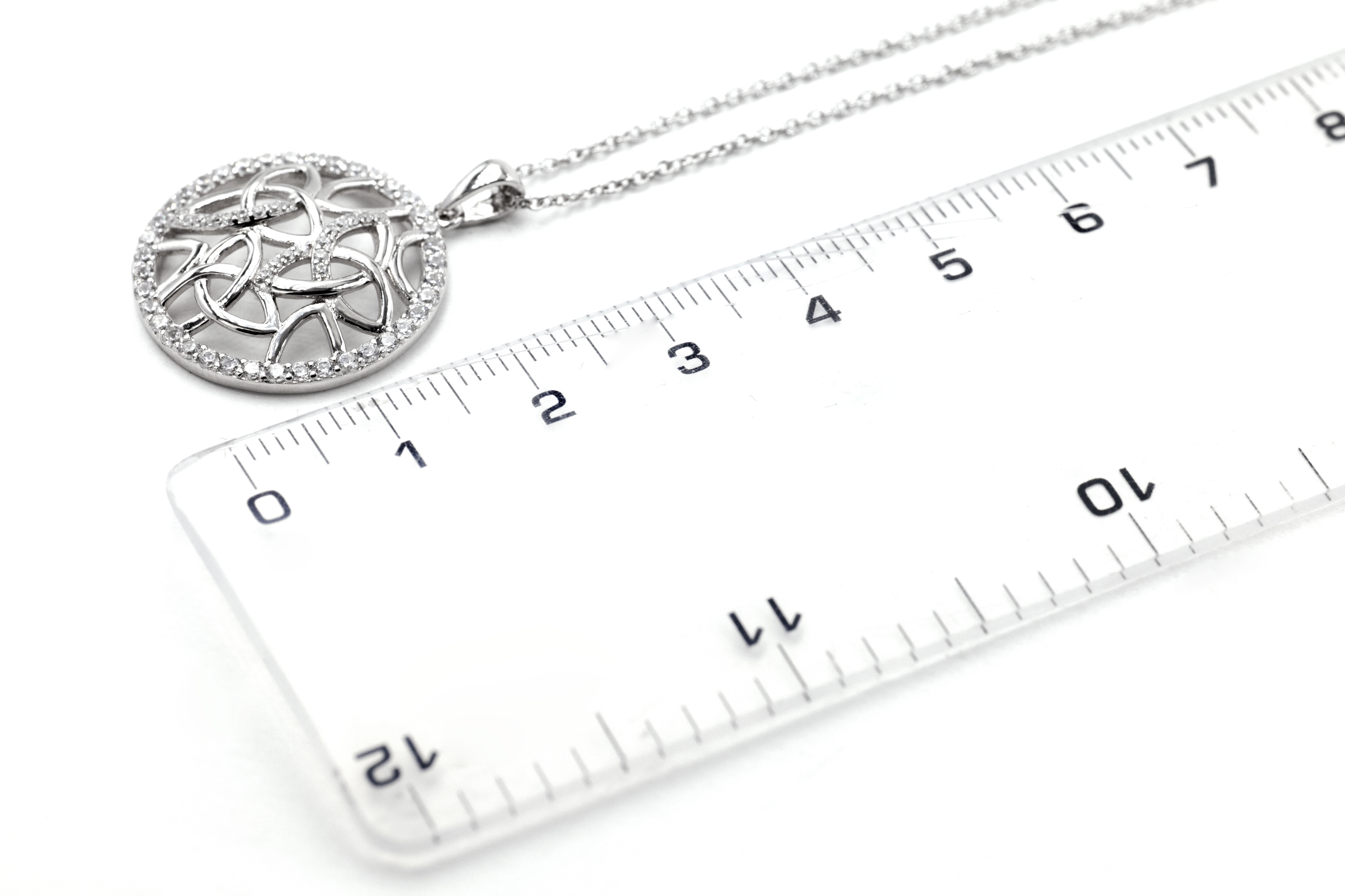 Genuine Sterling Silver Trinity Knot Necklace With a Polished Finish For Women. Picture For Scale.