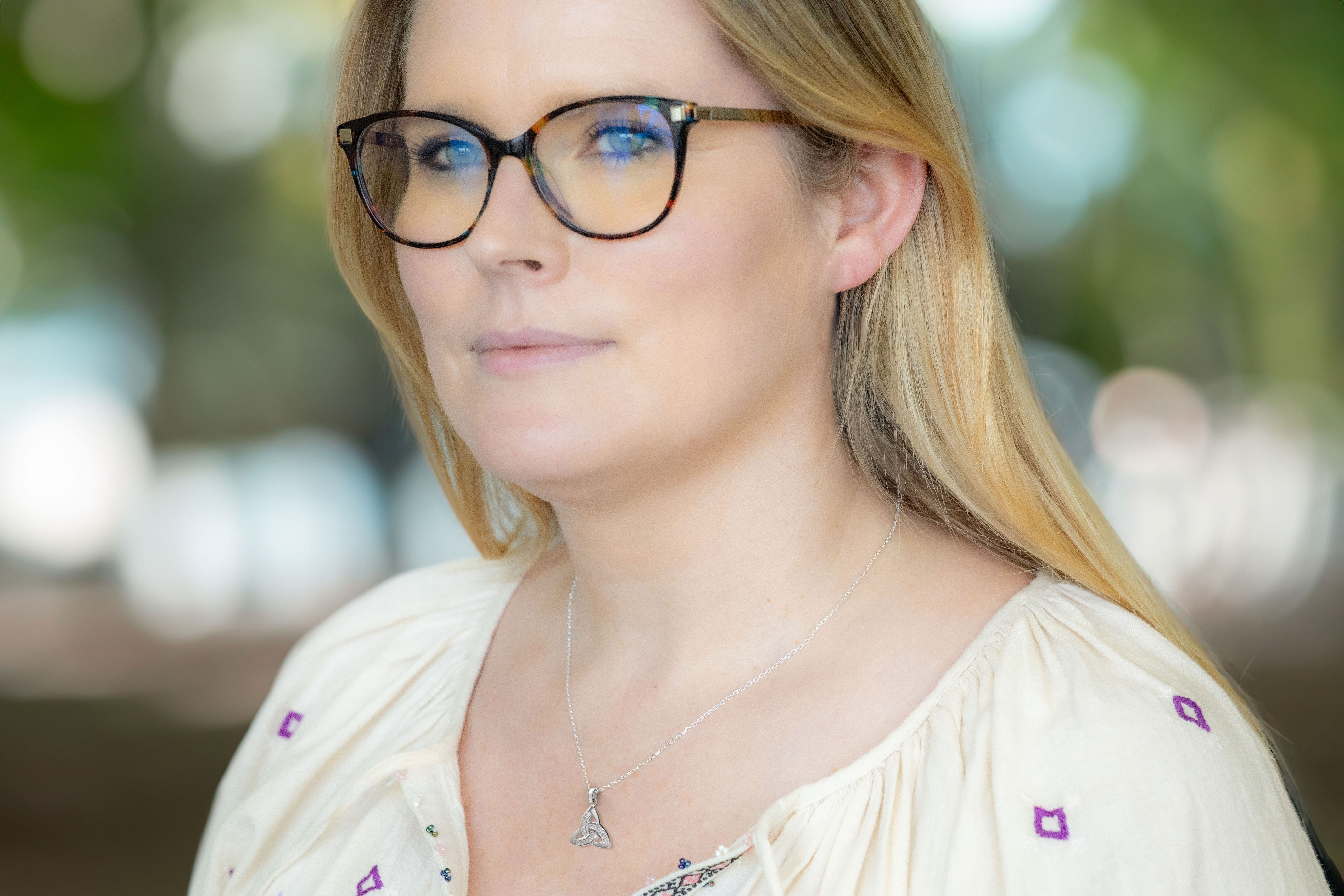 Womens Polished Sterling Silver Trinity Knot Necklace - Model Photo