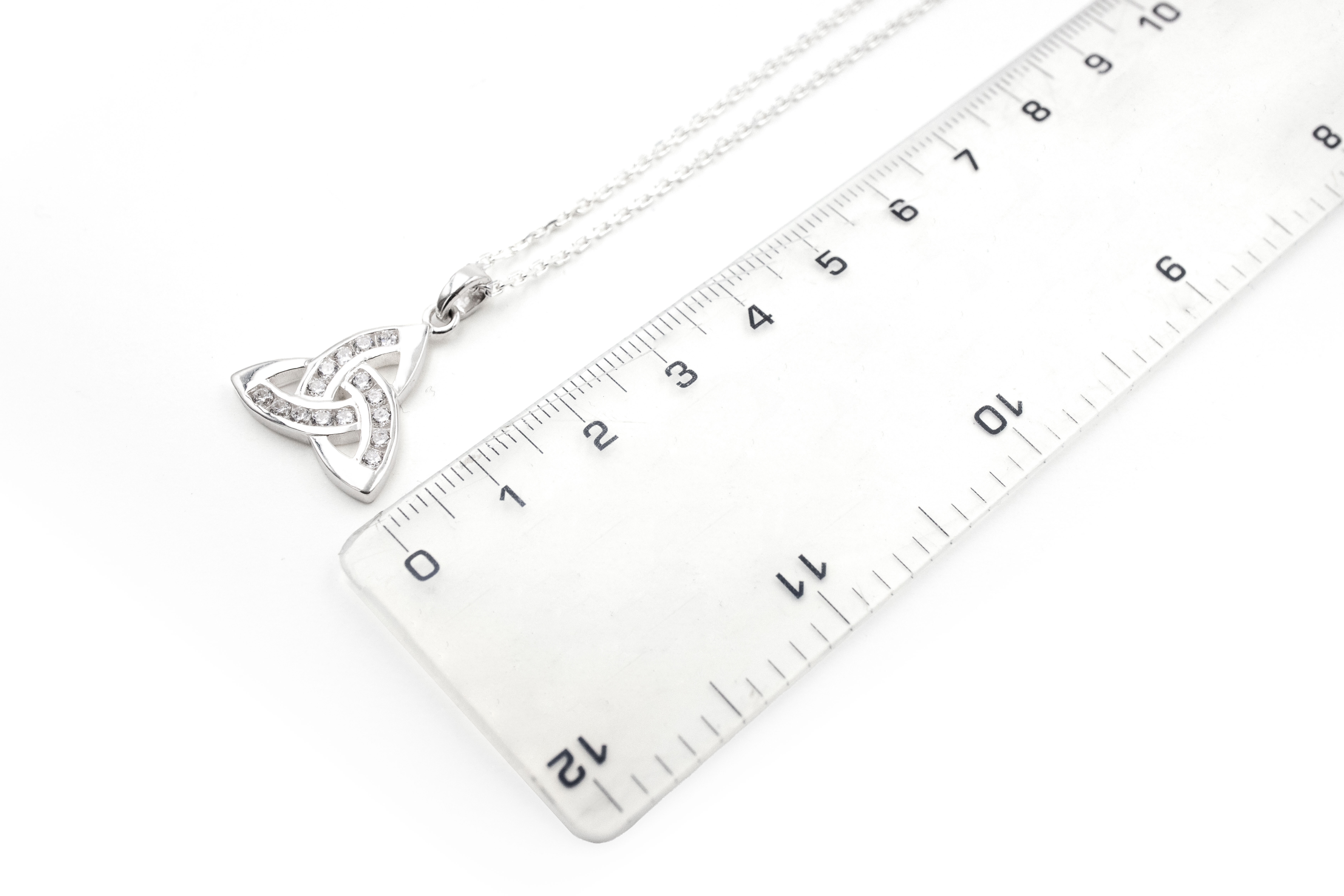 Womens Trinity Knot Necklace in Sterling Silver With a Polished Finish. Picture For Scale.