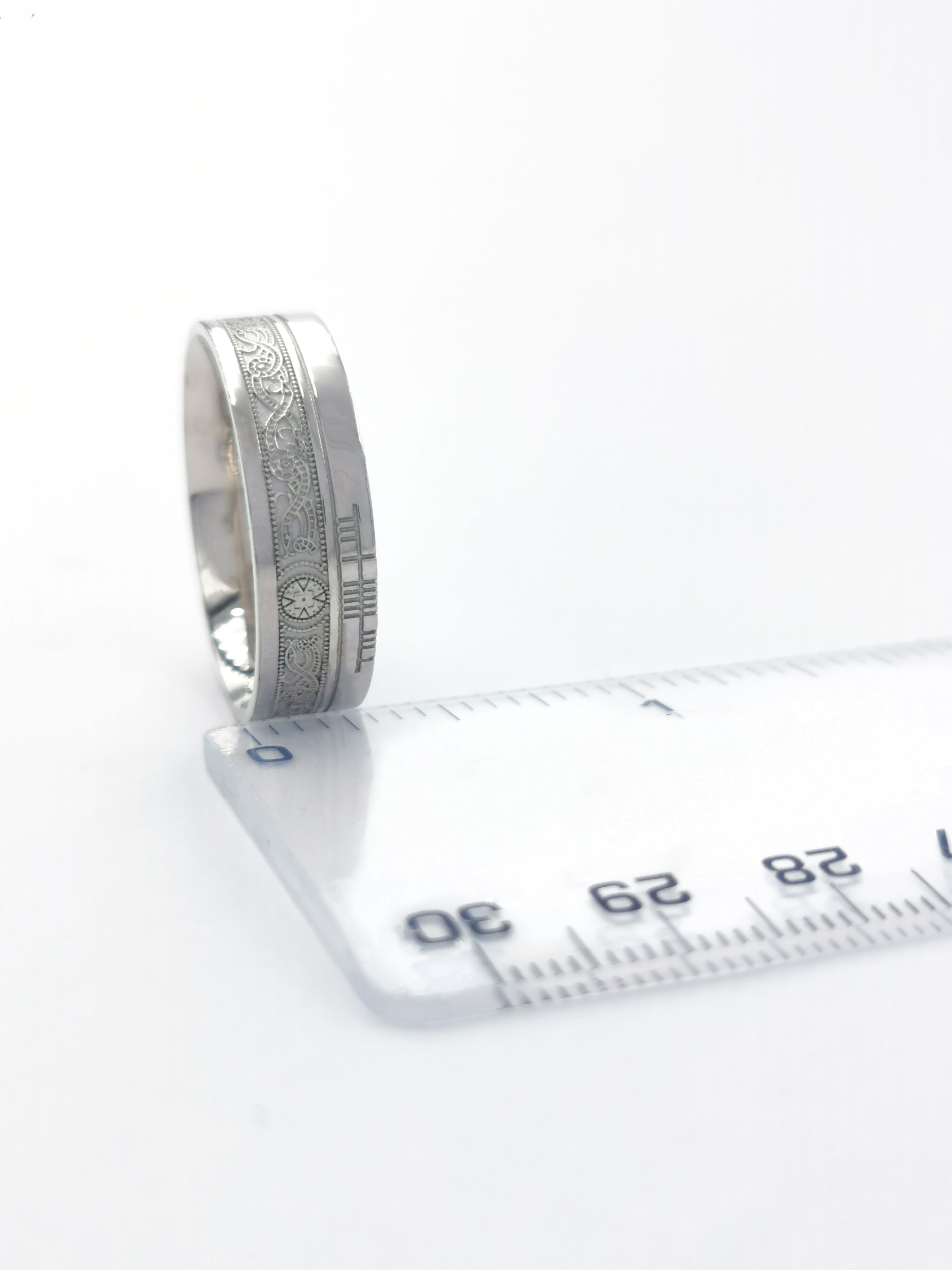 Engravable Platinum 950 Ogham & Celtic Warrior Engravable 5.2mm Ring With a Florentine Finish. Picture For Scale.