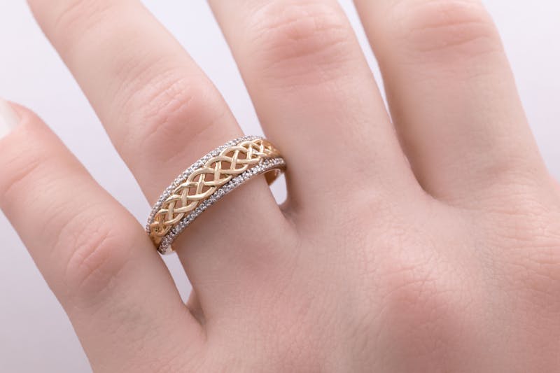 Striking 14K Yellow Gold Celtic Knot Wedding Ring For Women With a Polished Finish