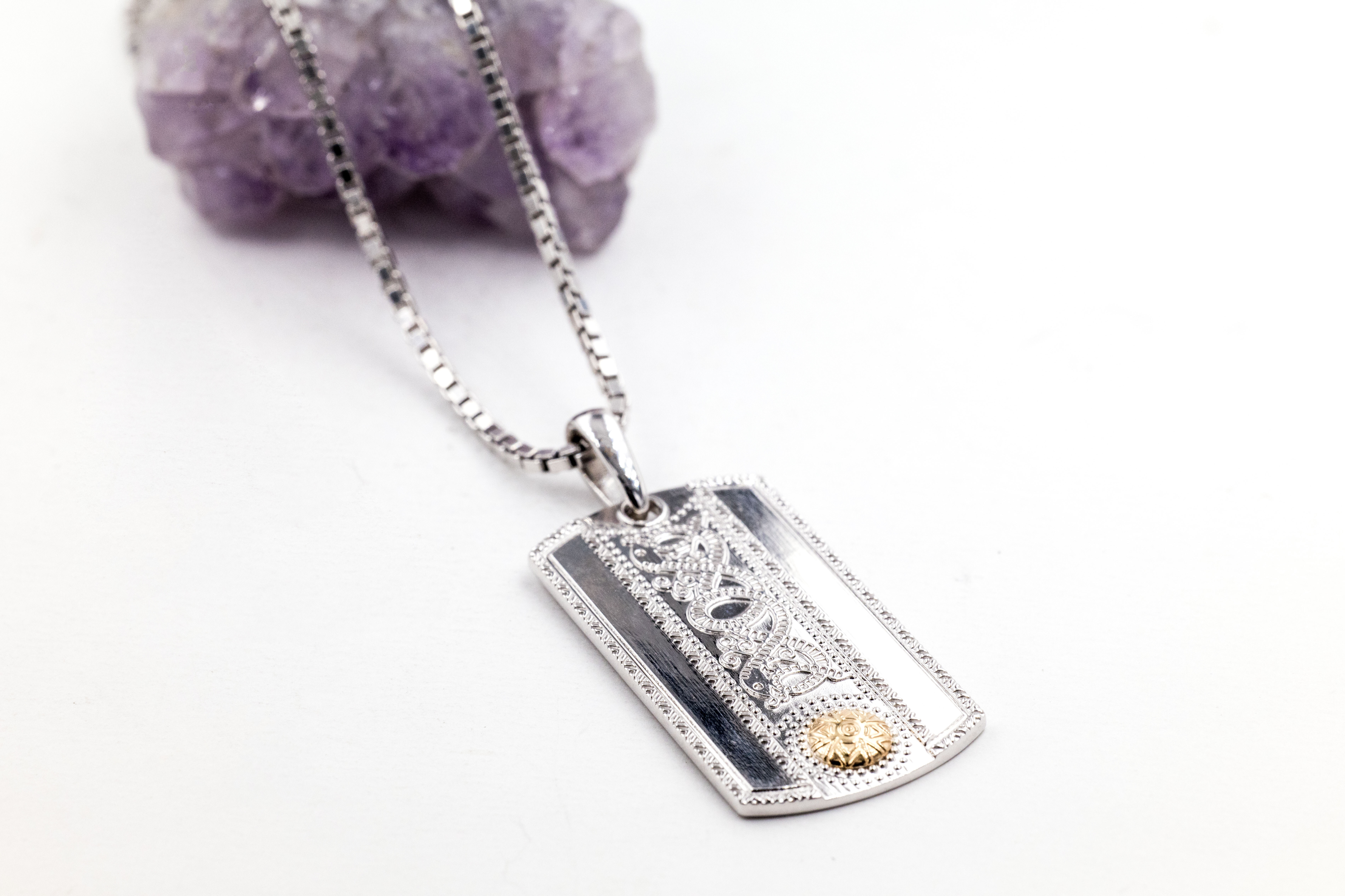 Irish Sterling Silver & 18K Yellow Gold Celtic Warrior Necklace With a Polished Finish For Men. Pictured Flat.