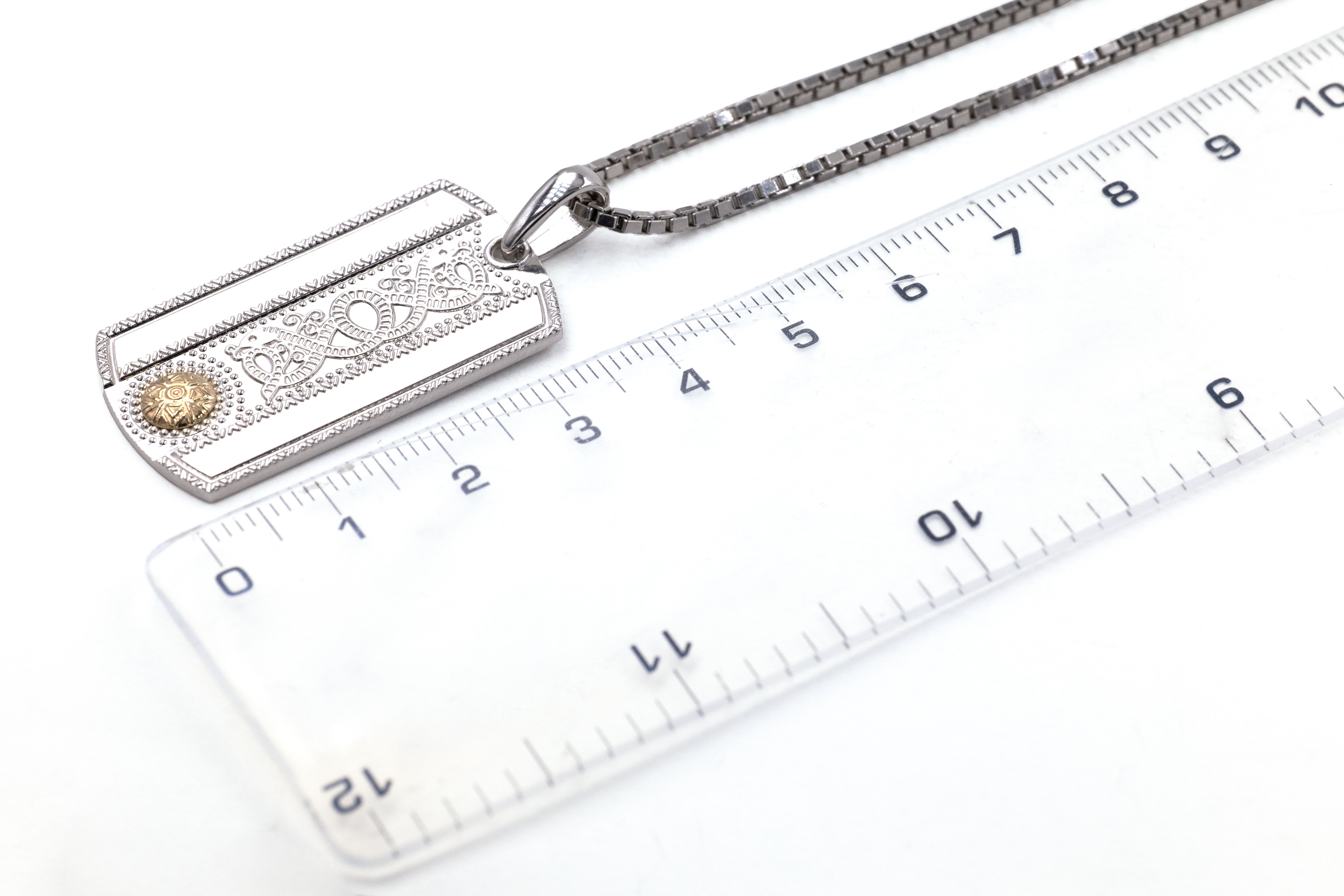 Irish Sterling Silver & 18K Yellow Gold Celtic Warrior Necklace For Men With a Polished Finish. Picture For Scale.