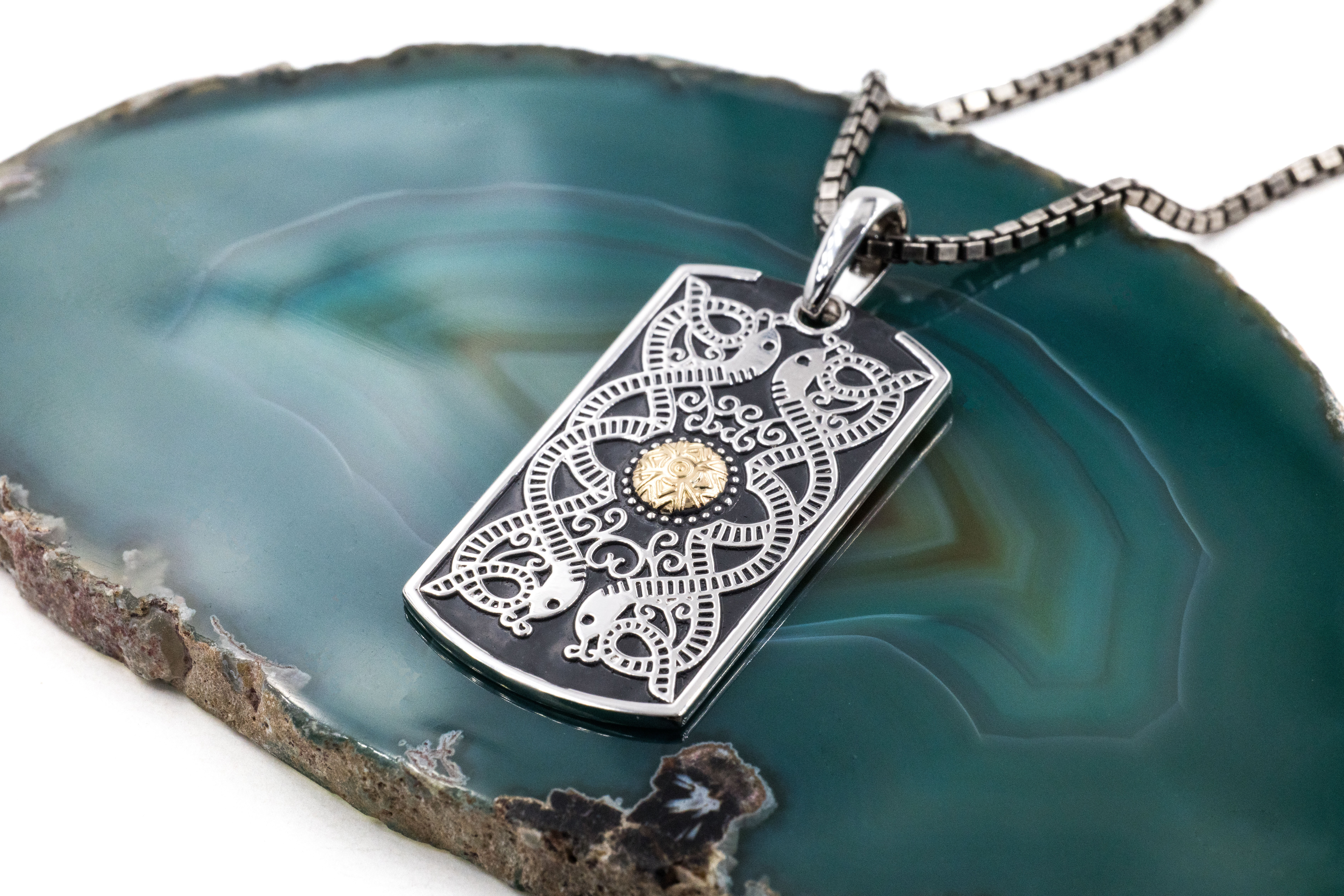 Irish Sterling Silver & 18K Yellow Gold Celtic Warrior Necklace With a Oxidised Finish For Men. Pictured Flat.