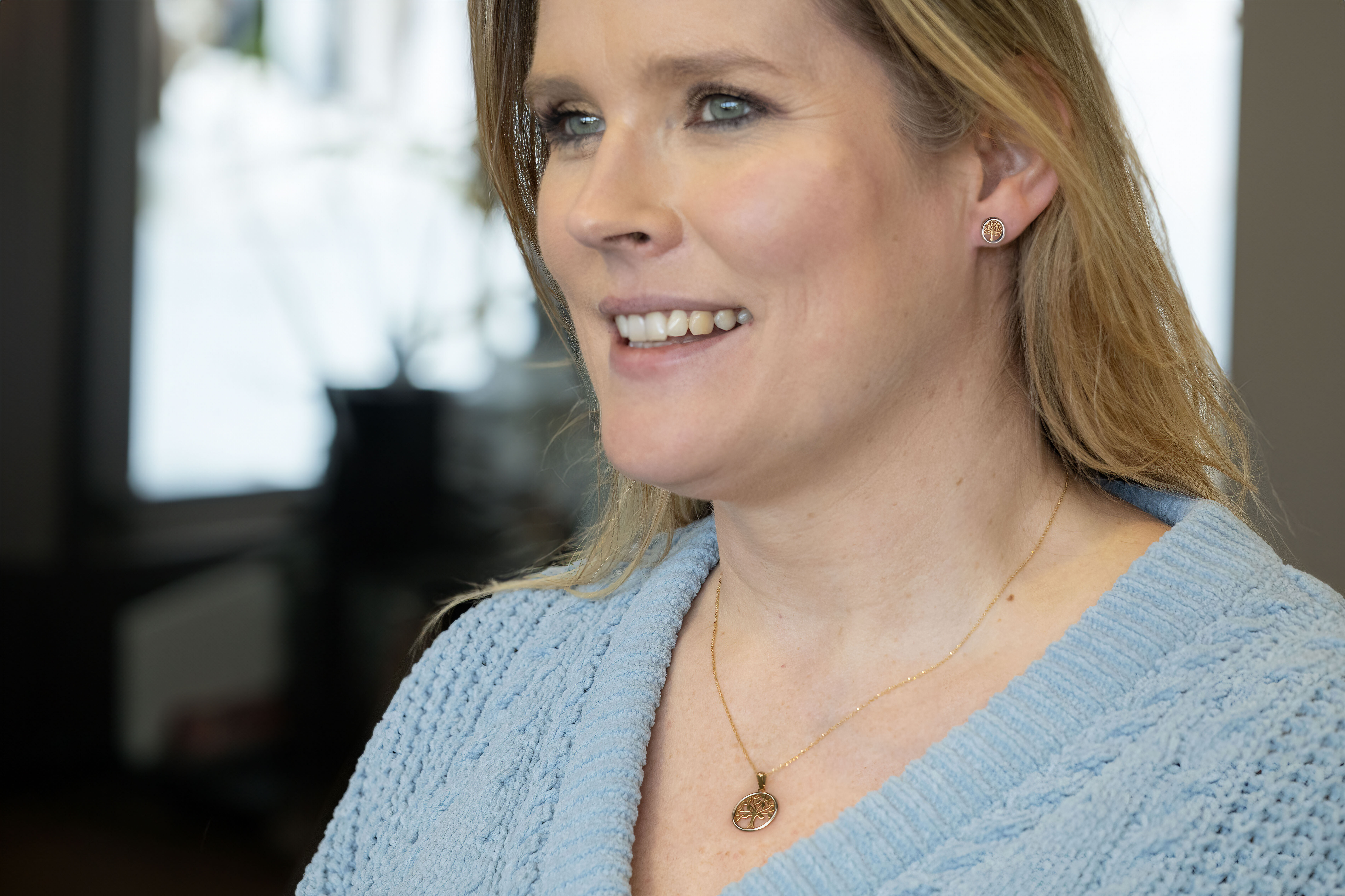 Womens Tree of Life Earrings in Yellow Gold & White Gold With a Polished Finish - Model Photo