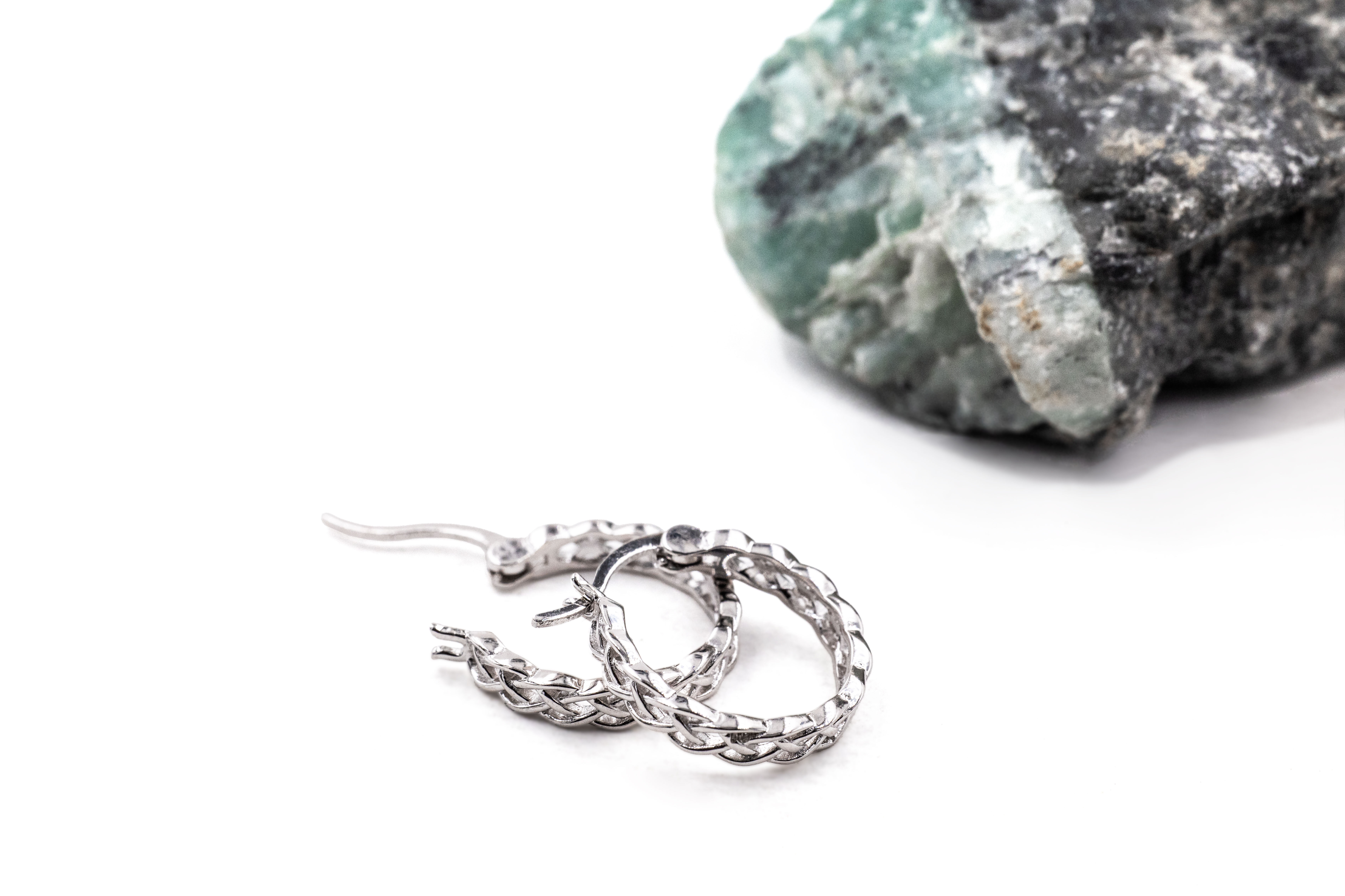 Small Womens Authentic Polished Sterling Silver Celtic Knot Earrings. Side View.