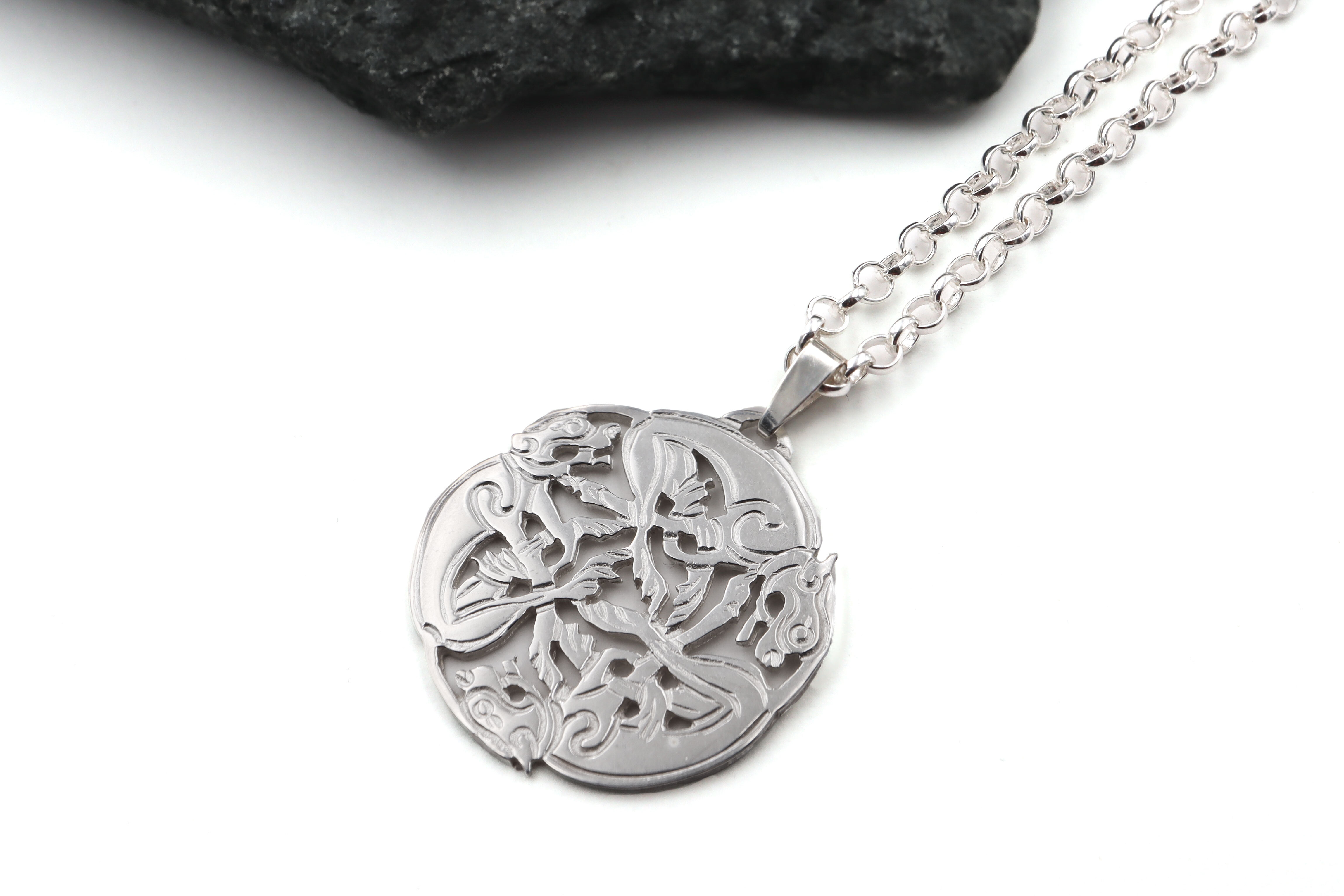 Womens Small Book of Kells Necklace in Real Sterling Silver. Pictured Flat.