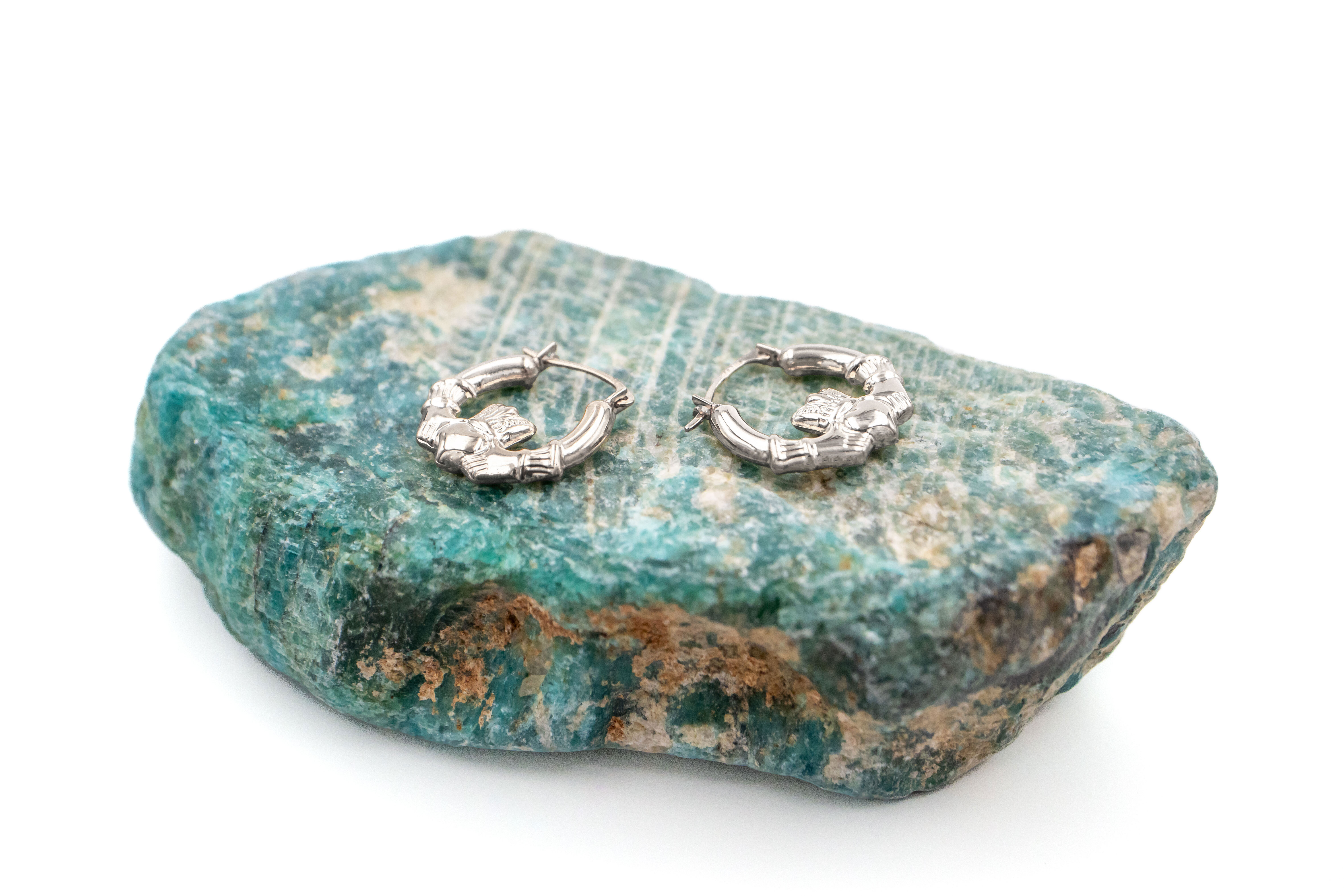 Small Real Sterling Silver Claddagh Earrings For Women. Pictured Flat.