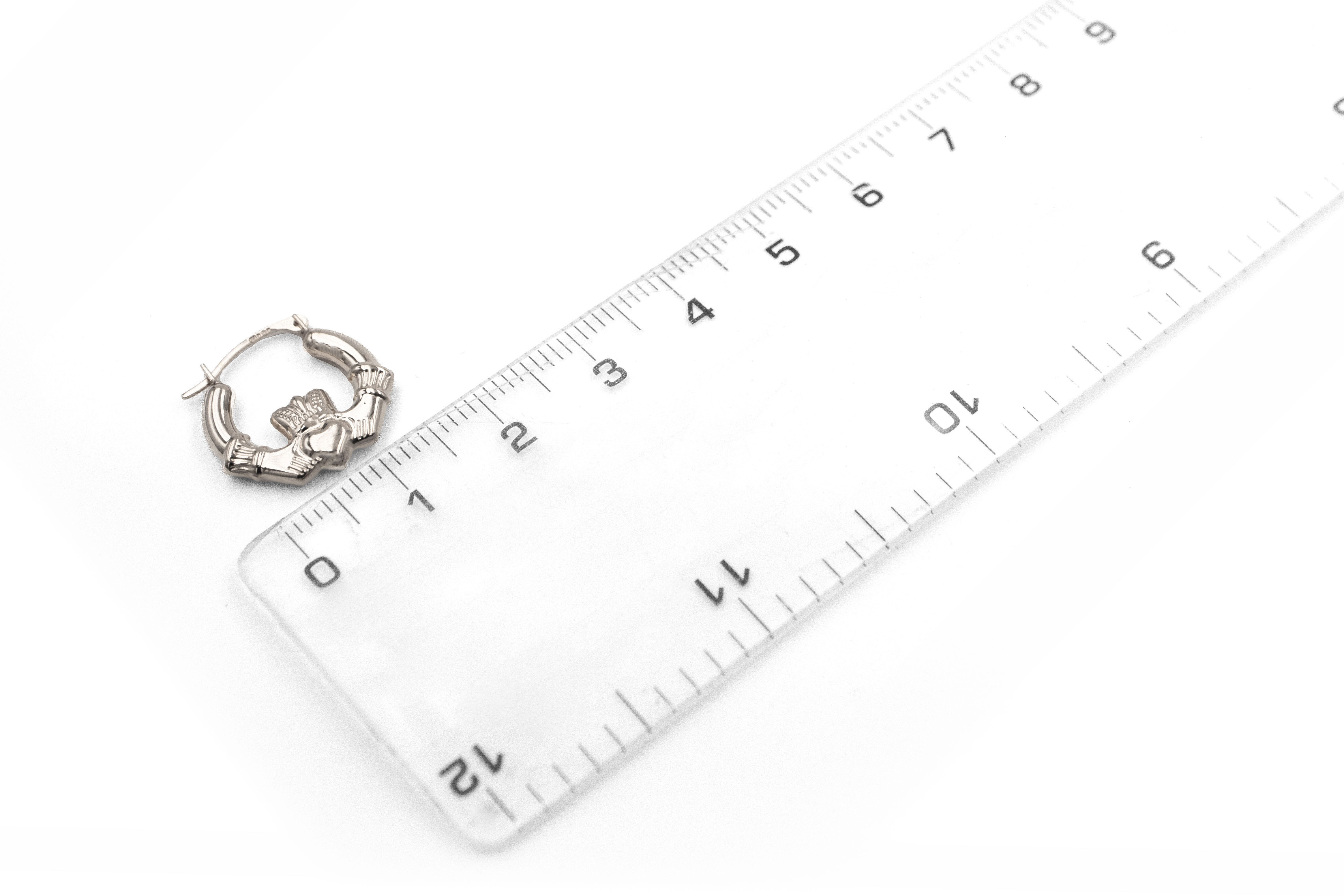 Womens Claddagh Earrings in Sterling Silver. Picture For Scale.