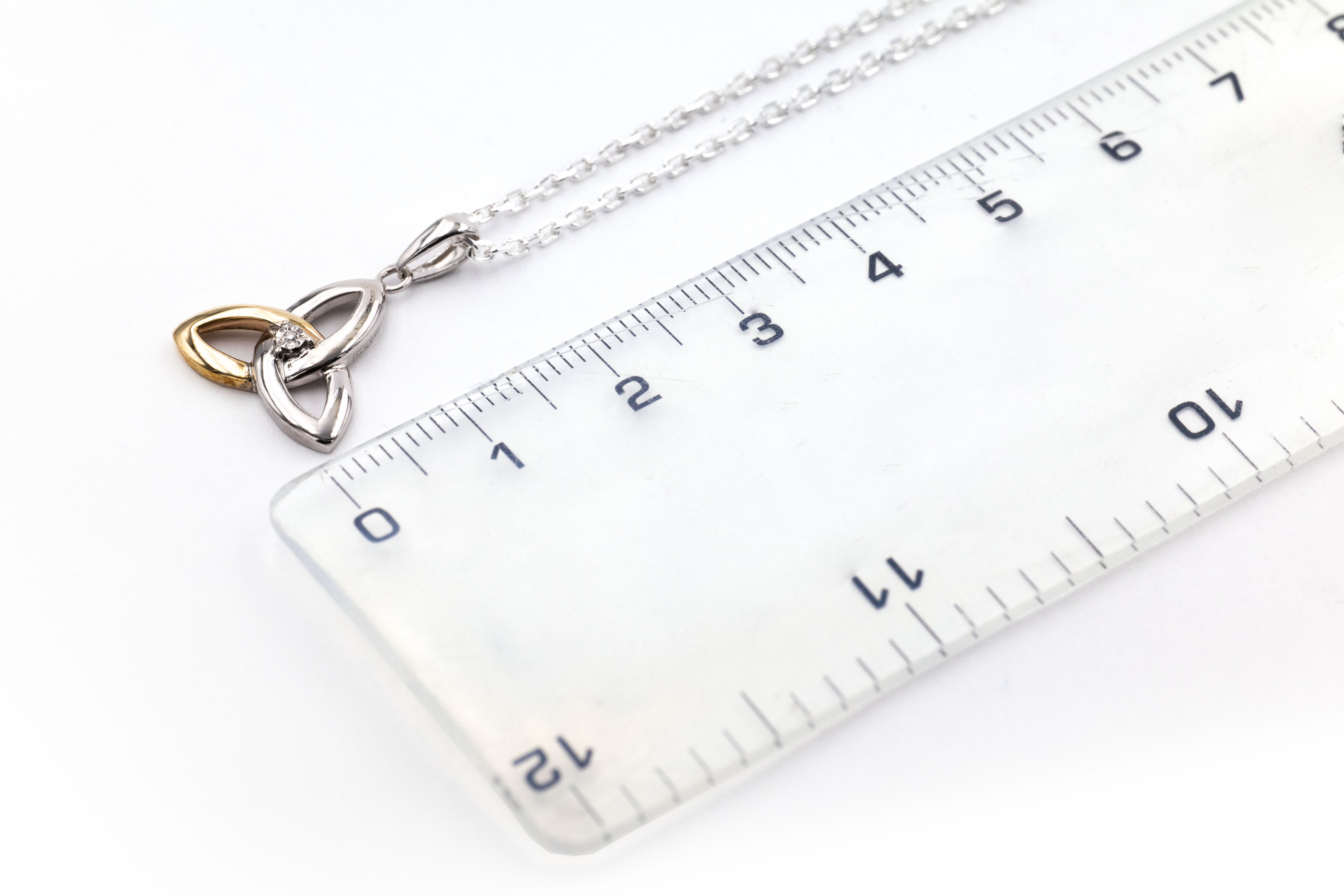 Womens Trinity Knot Necklace in Real Sterling Silver & Yellow Gold. Picture For Scale.