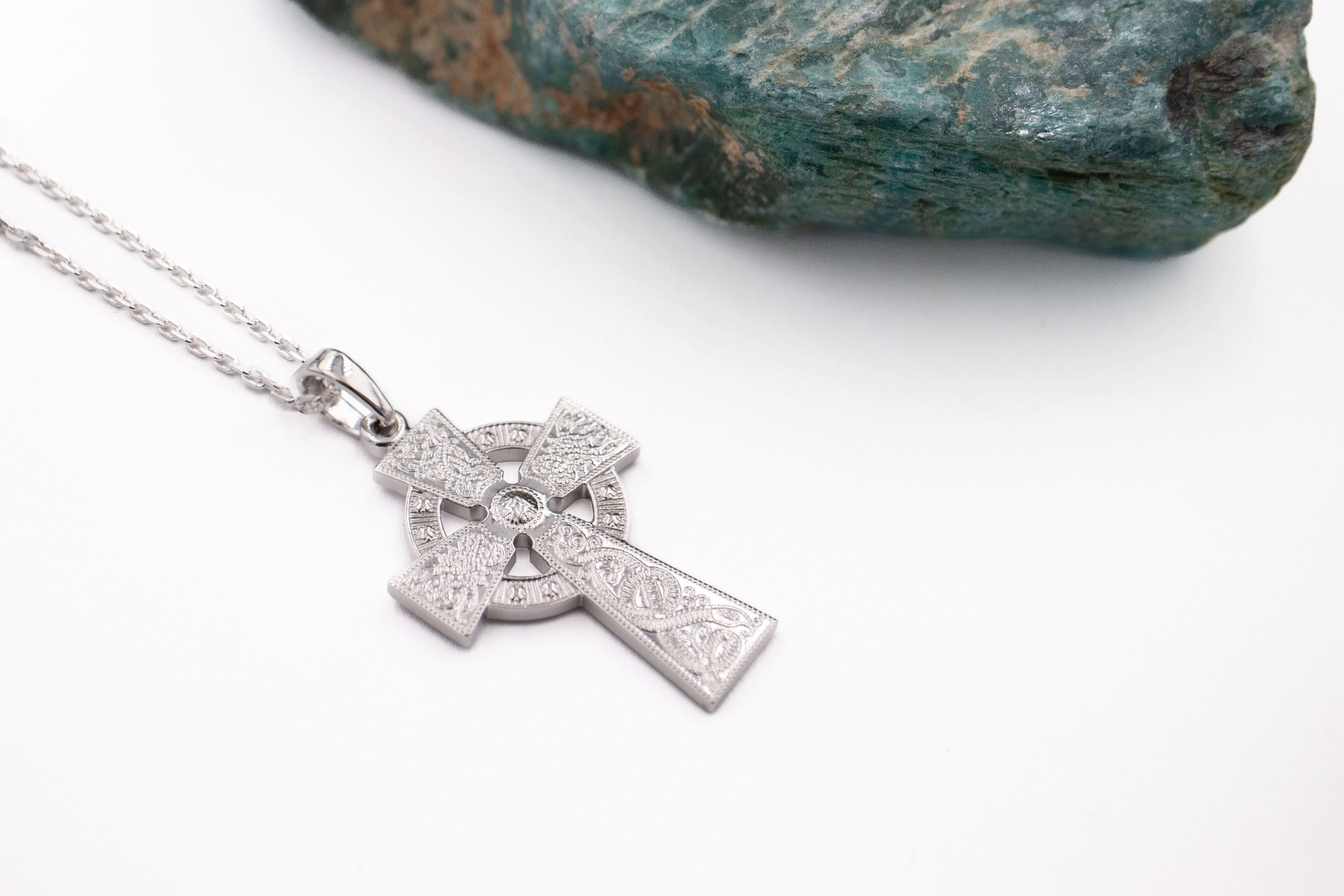 Striking White Gold Celtic Cross Necklace. Pictured Flat.