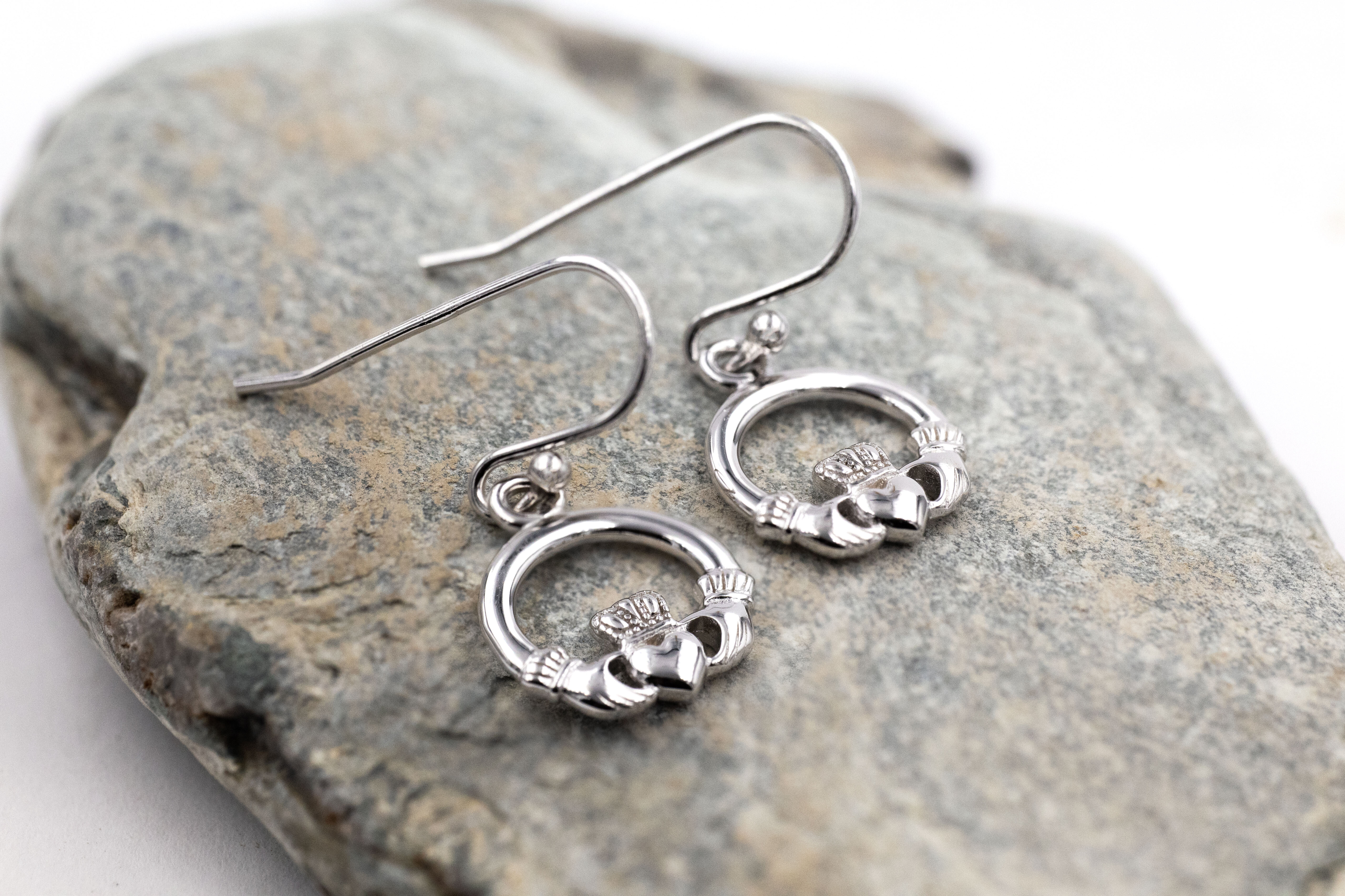 Womens Sterling Silver Claddagh Earrings. Pictured Flat.