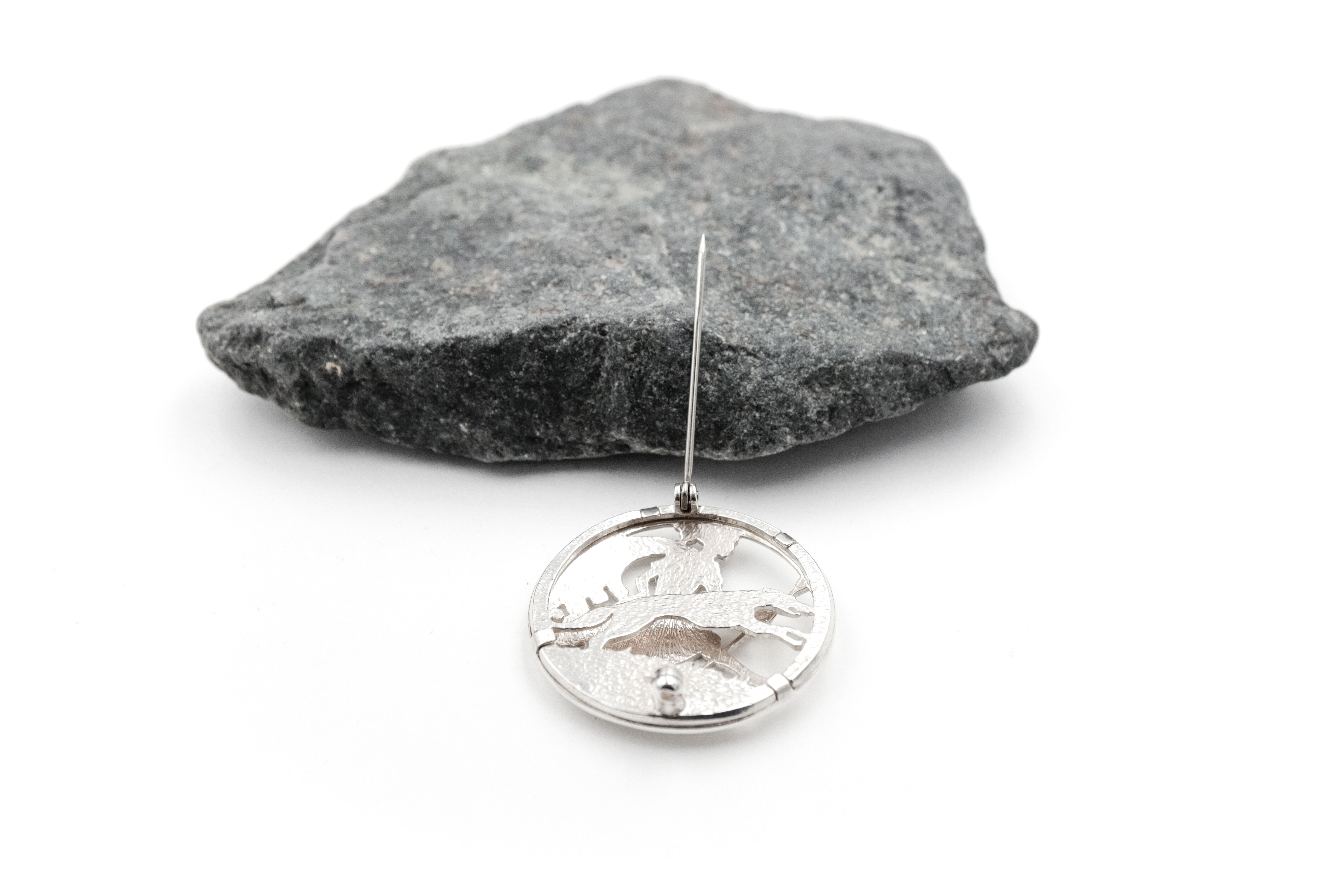 Authentic Polished Sterling Silver Folklore Brooch. Photographed Open.