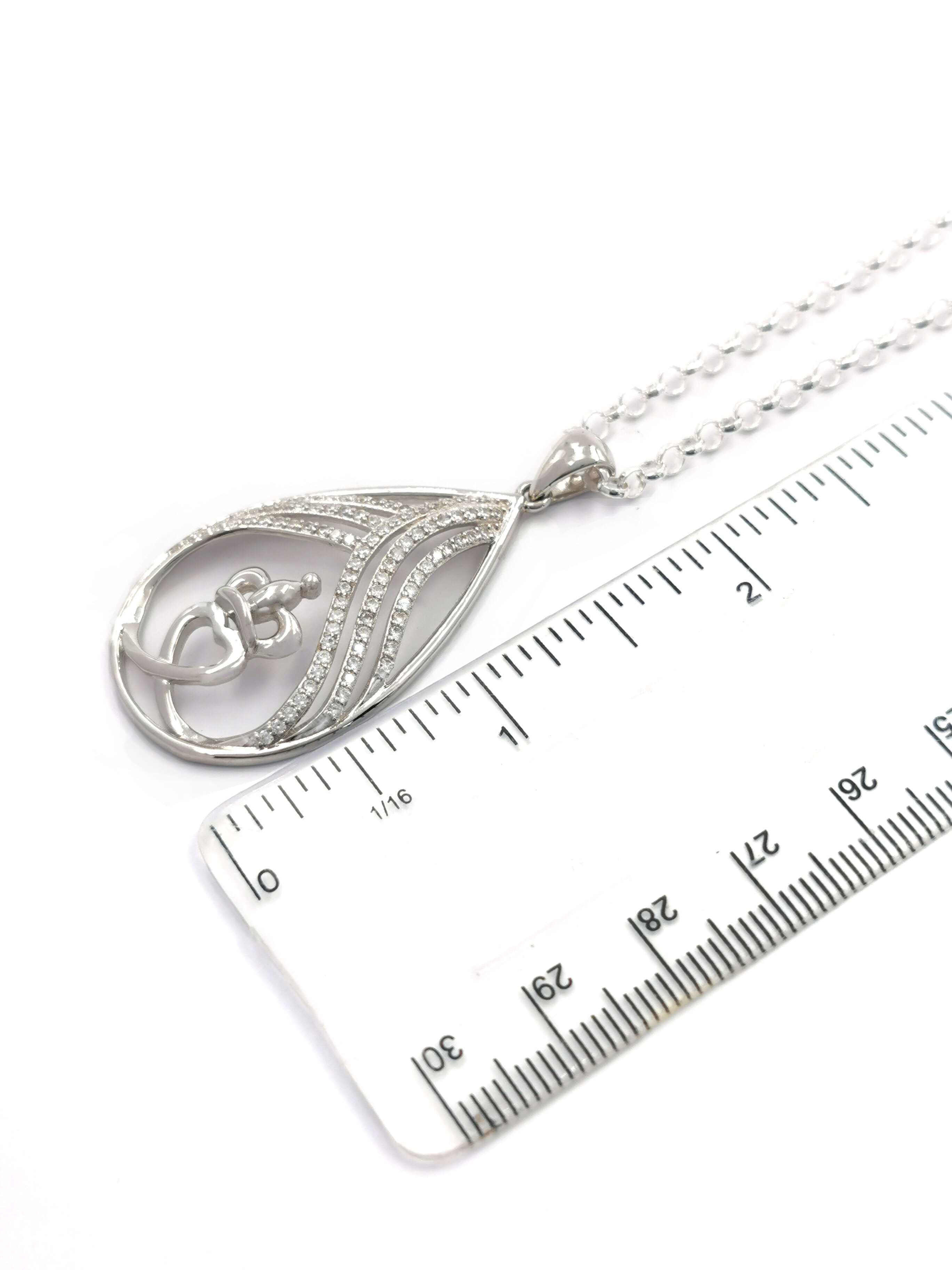 Womens Claddagh Necklace in Sterling Silver. Picture For Scale.