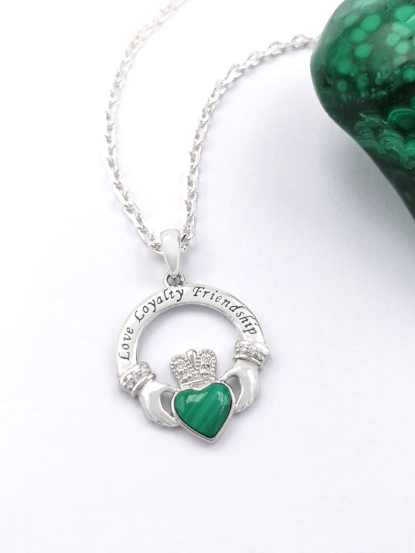 Womens Claddagh Necklace in Sterling Silver. Pictured Flat.