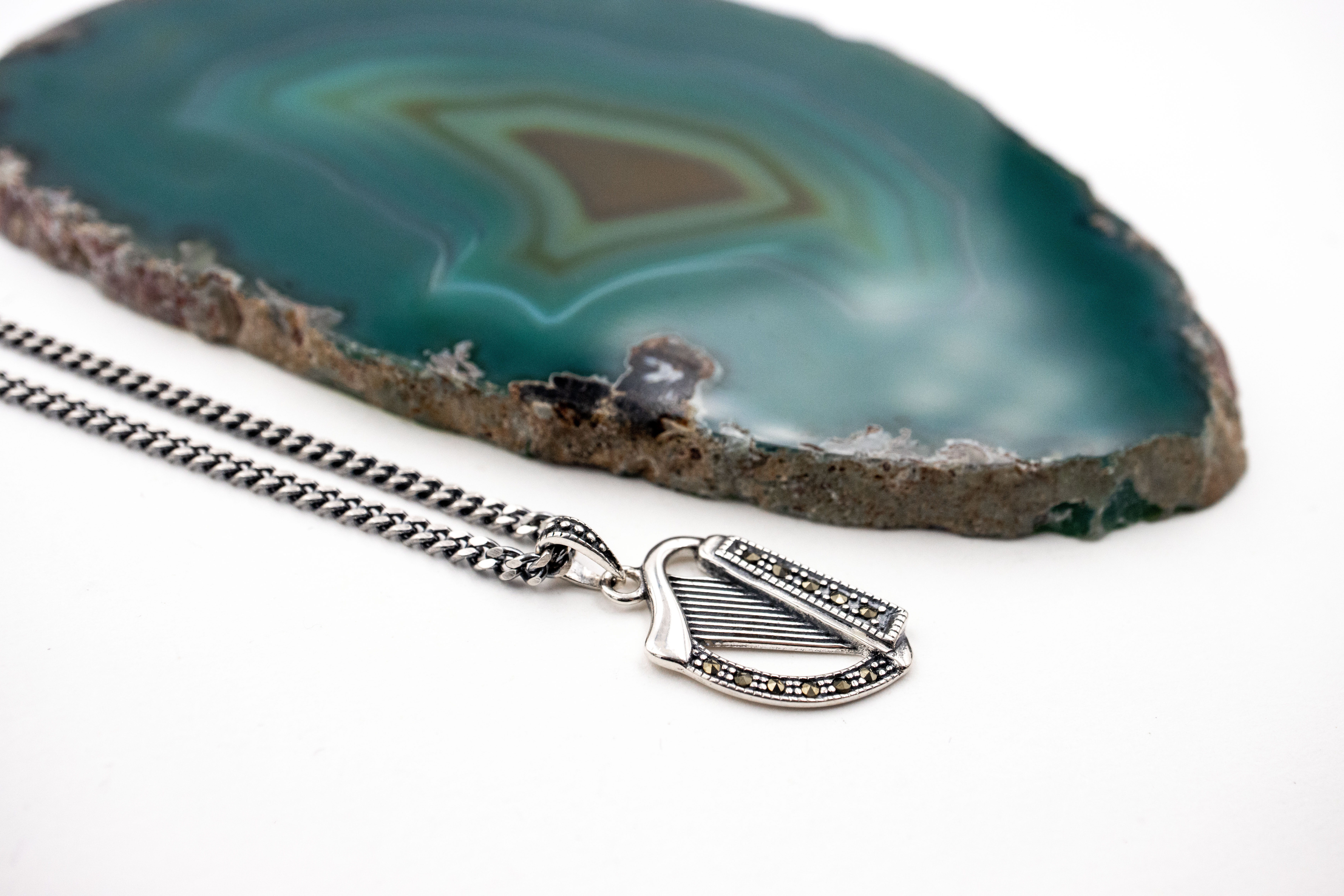 Irish Harp Necklace in Sterling Silver. Pictured Flat.