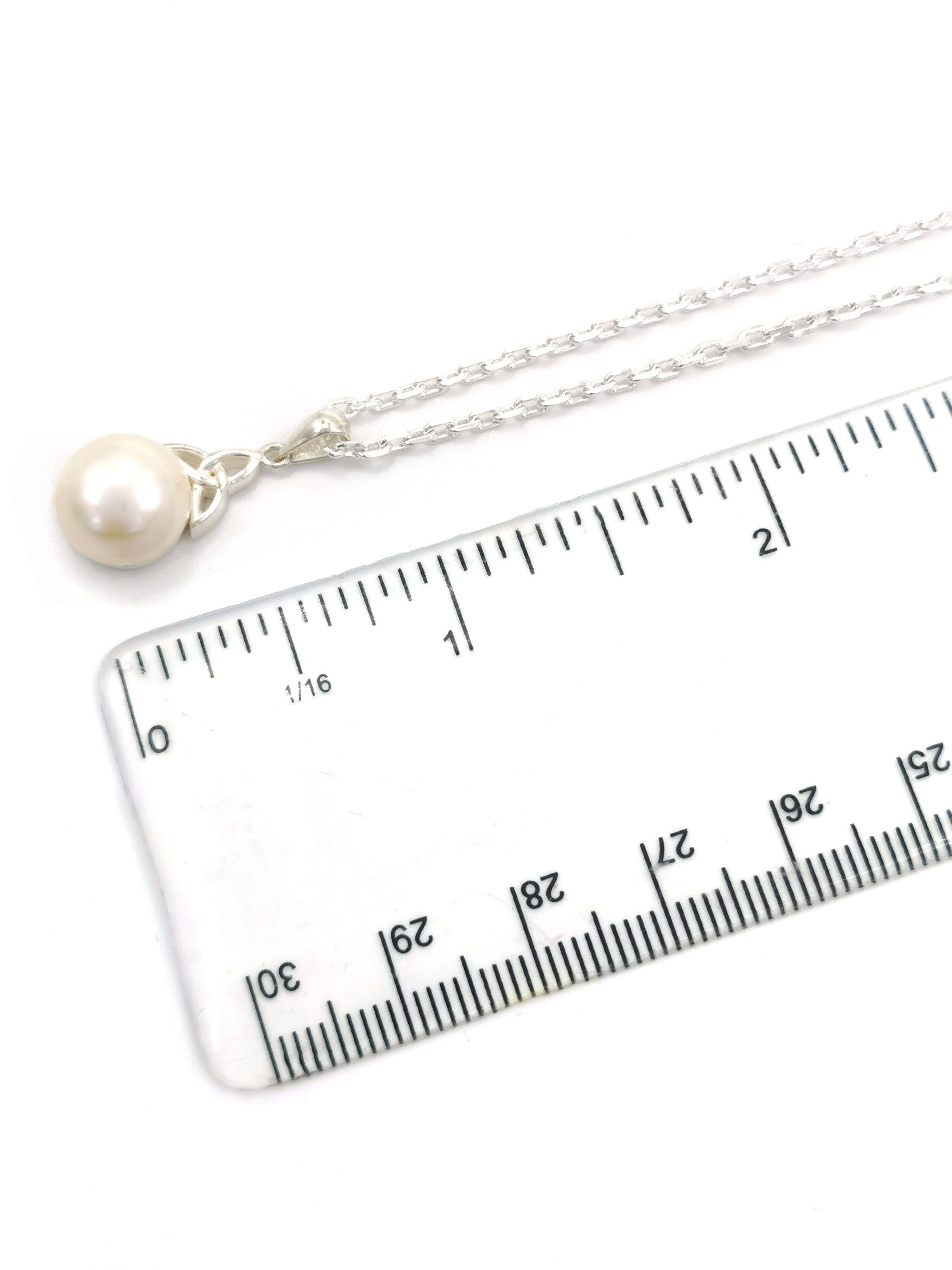 Womens Trinity Knot Necklace in Sterling Silver. Picture For Scale.