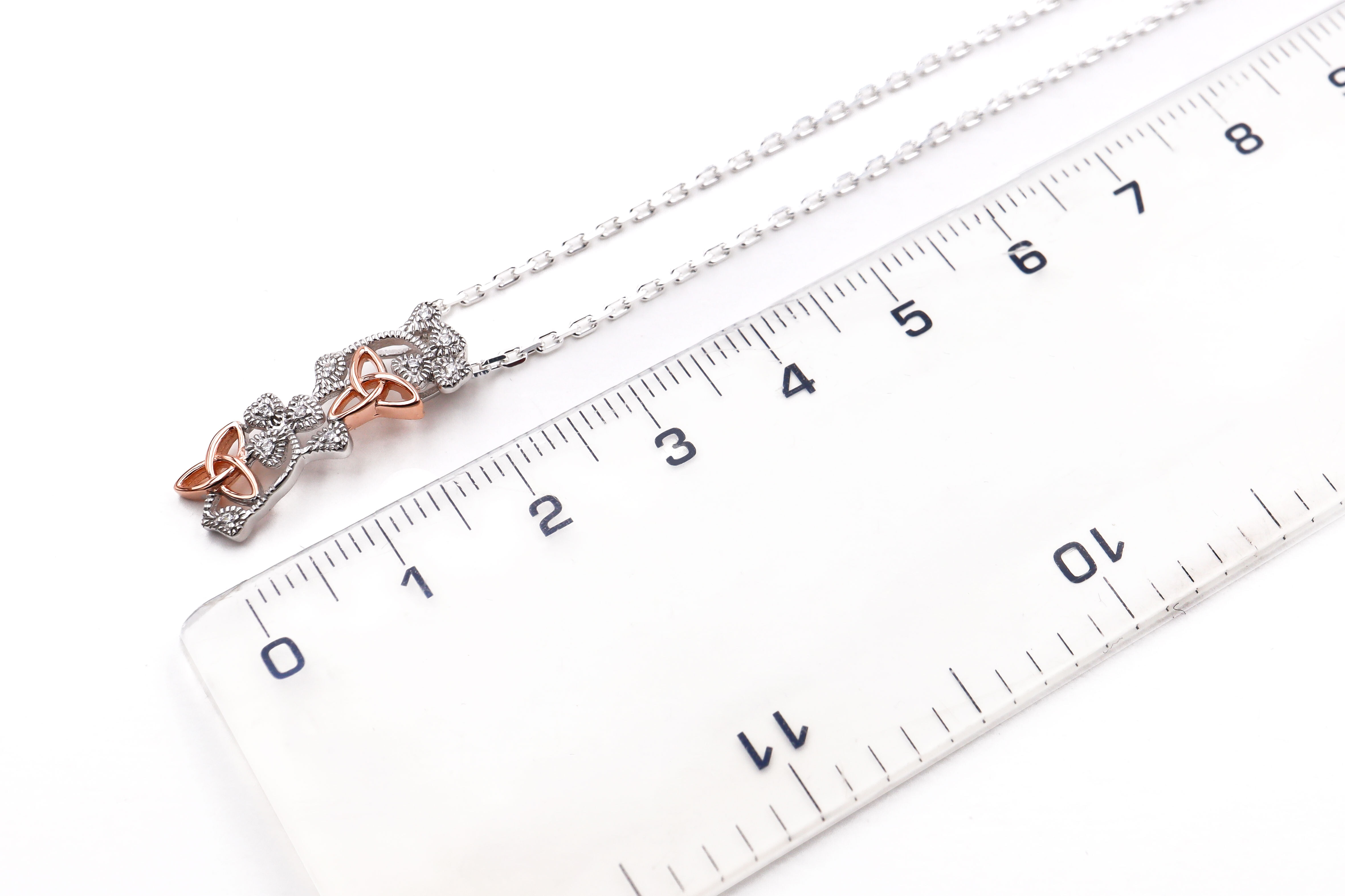 Womens Trinity Knot & Shamrock Necklace in Real Sterling Silver. Picture For Scale.